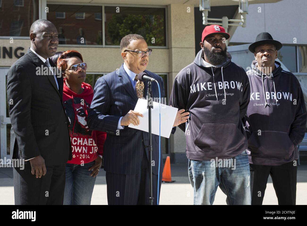 Michael Brown's family lawyers Anthony Gray (C) and Benjamin Crump (L), stand with his mother Lesley McSpadden (2nd L) and father Michael Brown Sr., as they announce the Brown family has filed a wrongful death lawsuit against the city of Ferguson in front of the St. Louis County Circuit Court in Clayton, Missouri, April 23, 2015. The family of Michael Brown filed a wrongful death lawsuit against the city of Ferguson on Thursday, seeking unspecified damages and police reforms after the black teen's killing by a white policeman prompted a national debate on law enforcement and race. REUTERS/Kate Stock Photo