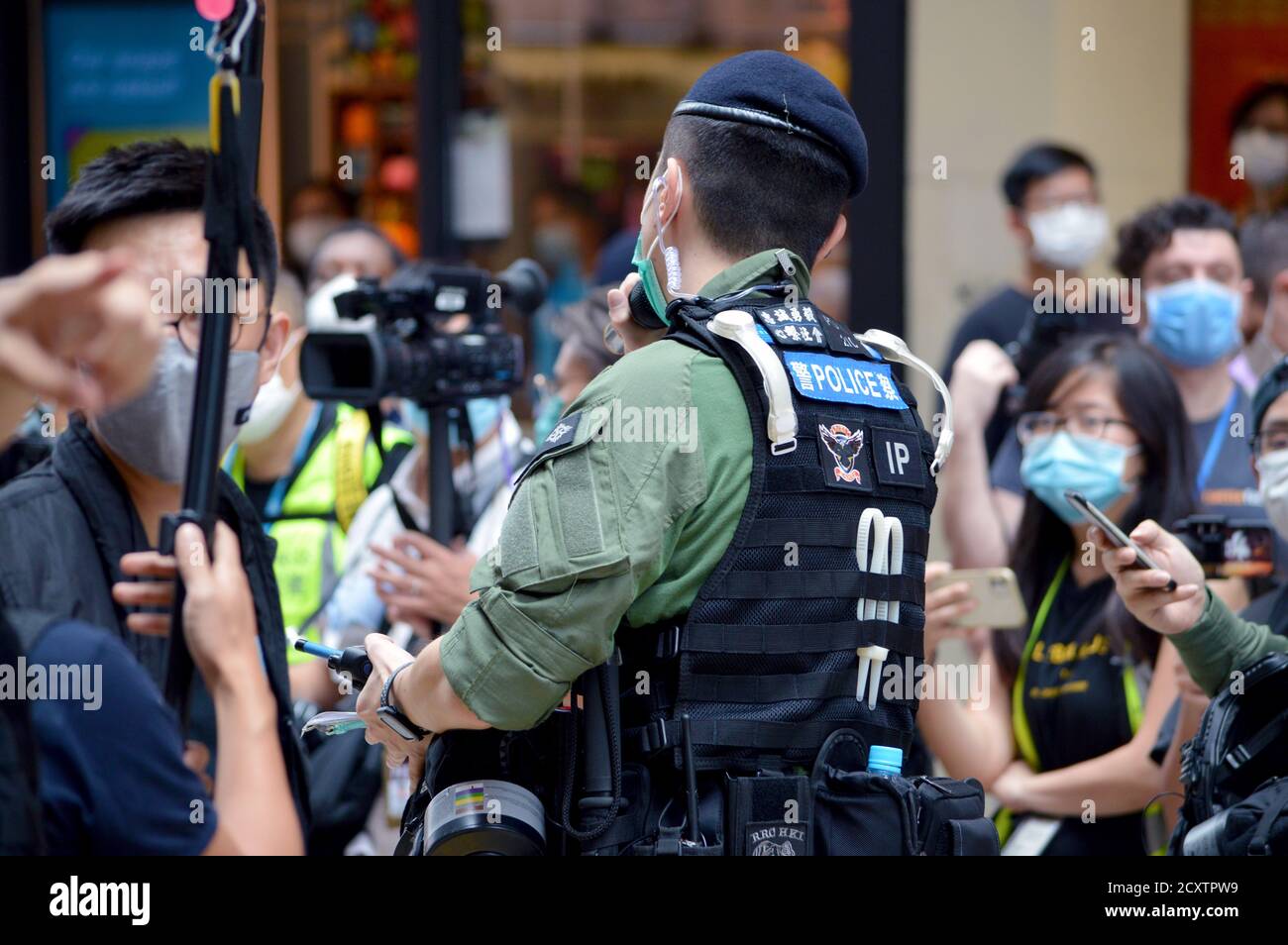 Hong Kong Police Force officer in Causeway Bay shopping district on National Day and Mid-Autumn Festival, 1 October 2020 Stock Photo