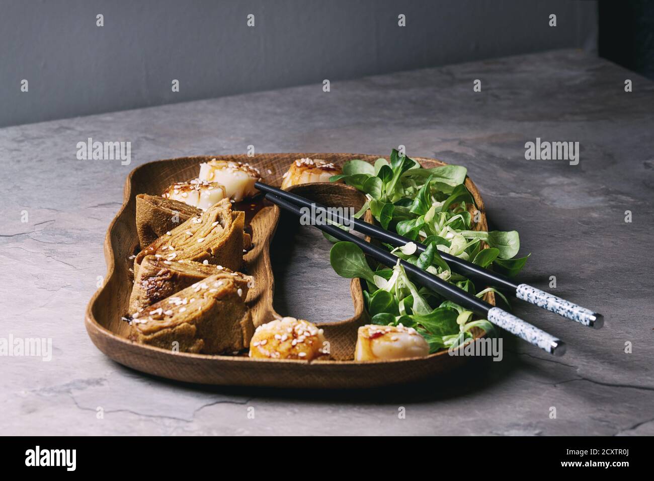 Asian style fried scallops with Japanese Rolled Omelette Tamagoyaki and soy sesame sauce in