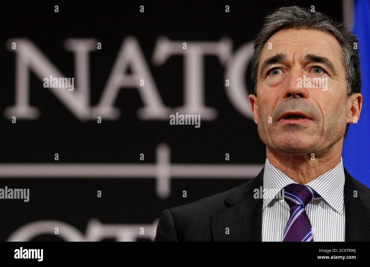 NATO Secretary General Anders Fogh Rasmussen holds a news conference during a NATO defence ministers meeting (NAC) at the Alliance headquarters in Brussels March 10, 2011. NATO defence ministers meeting in Brussels on Thursday and Friday will discuss options to respond to the turmoil in Libya, including a possible no-fly zone, the officials said.      REUTERS/Yves Herman (BELGIUM  - Tags: POLITICS CONFLICT MILITARY) Stock Photo
