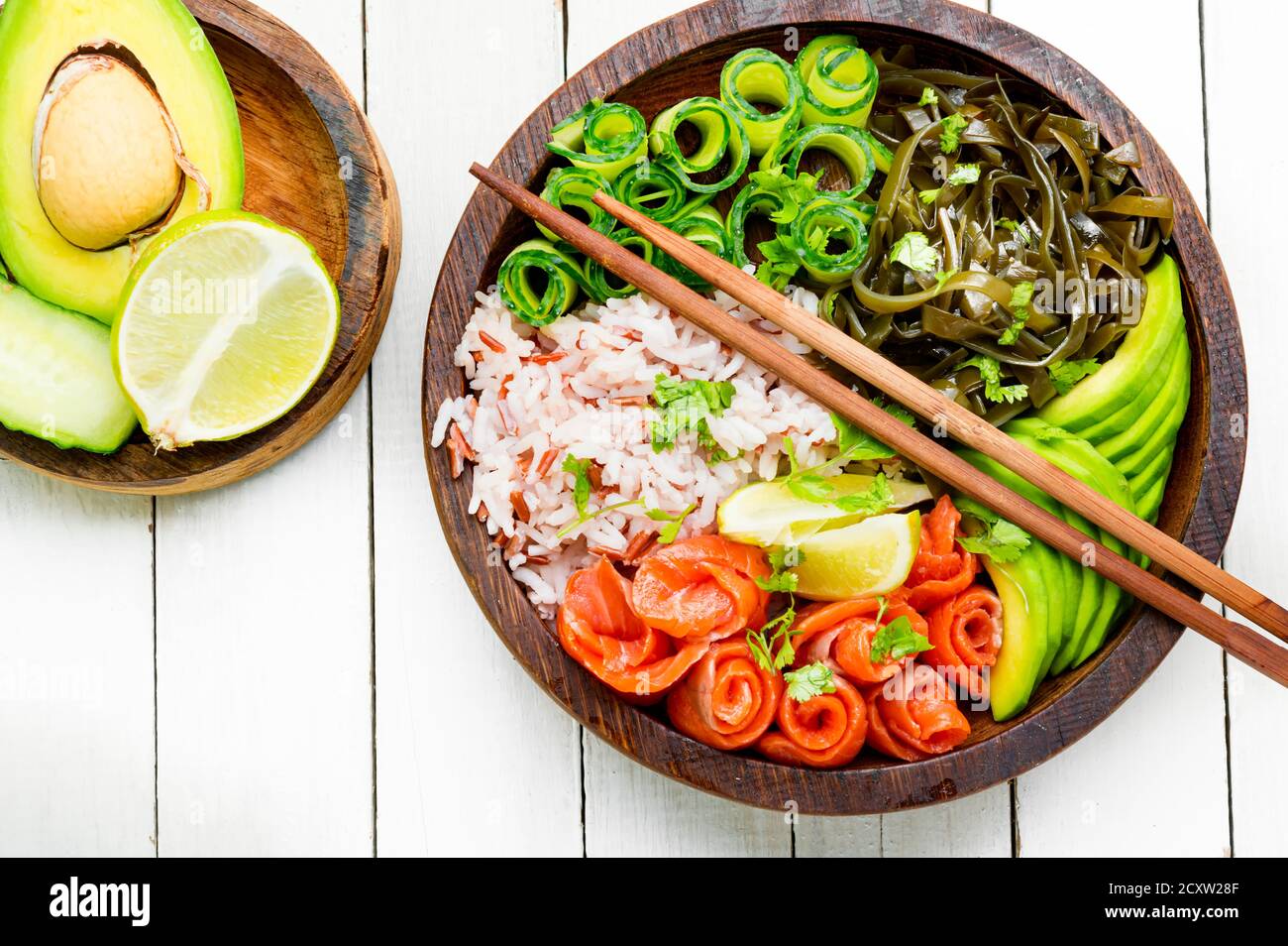 Hawaiian salmon poke bowl with rice,seaweed and avocado Stock Photo Alamy