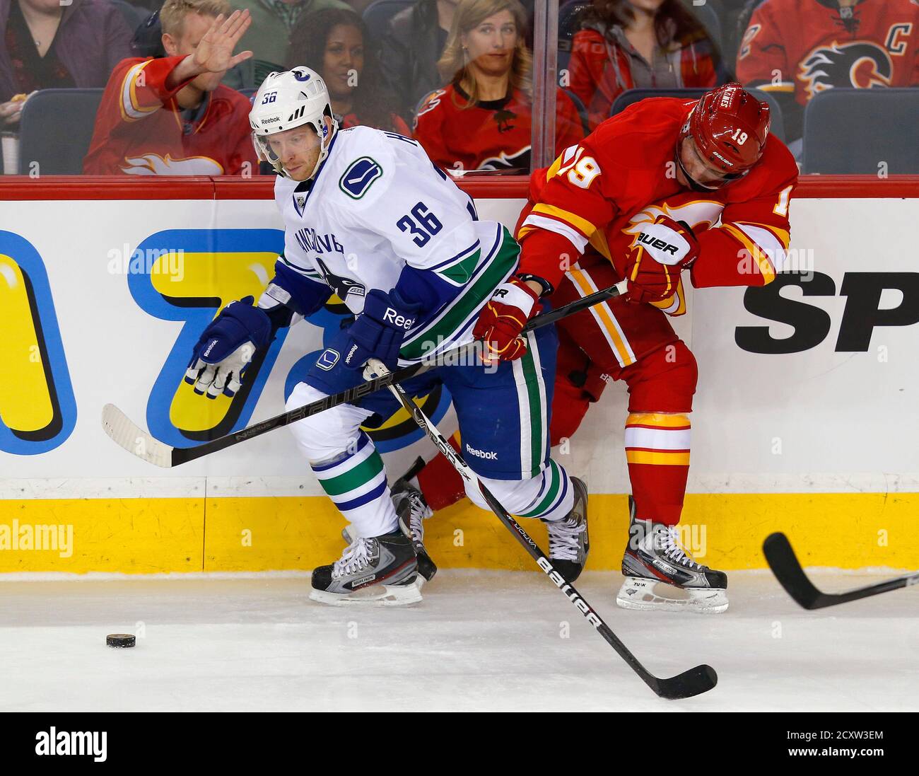 Vancouver Canucks Jannik Hansen L And Calgary Flames Blair Jones Battle For The Puck During The First Period Of Their Nhl Hockey Game In Calgary Alberta April 10 2013 Reuters Todd Korol Canada