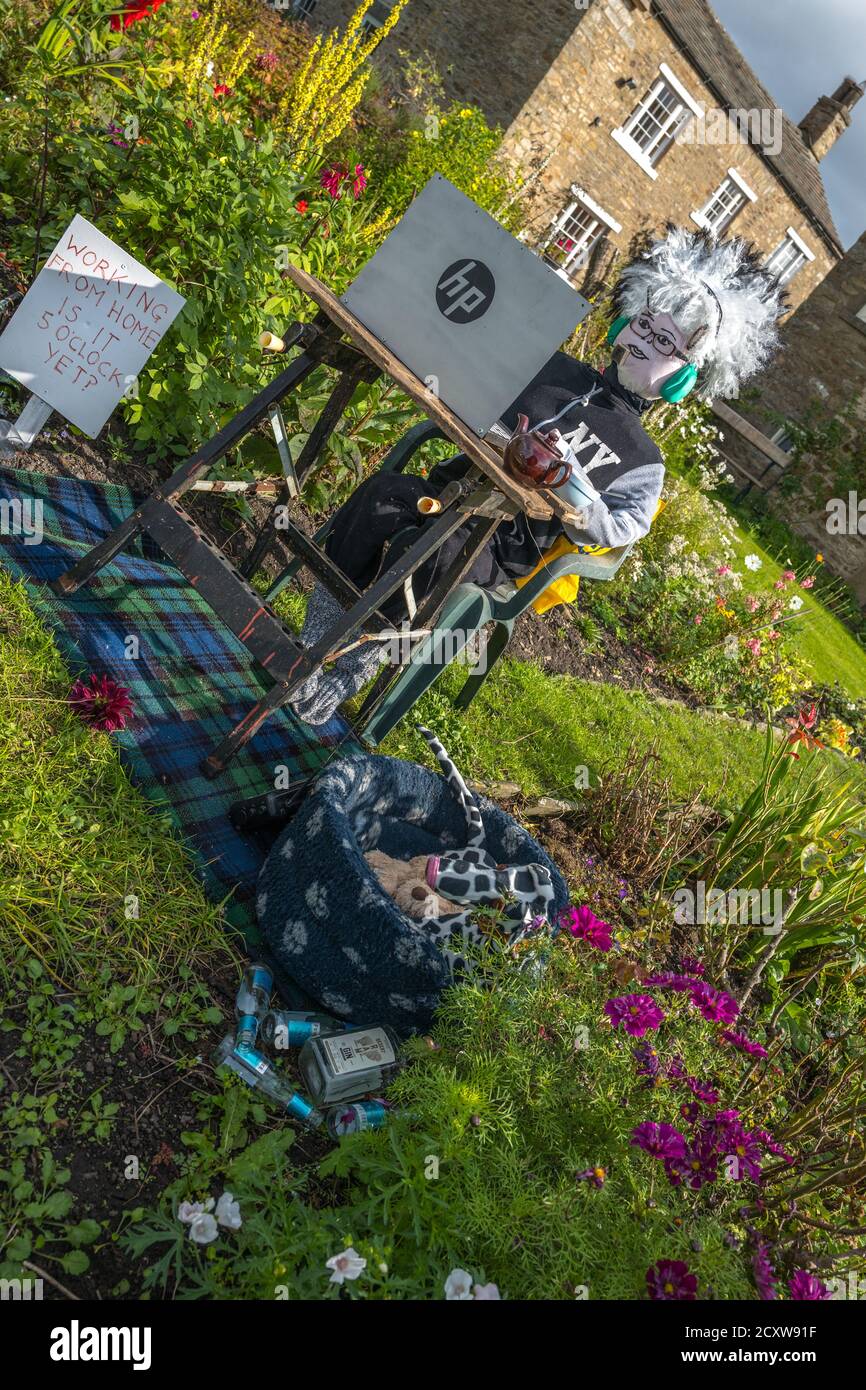 This years theme for the Yorkshire Dales village of Redmire annual scarecrow competition being Covid 19 and the Lockdown. Stock Photo