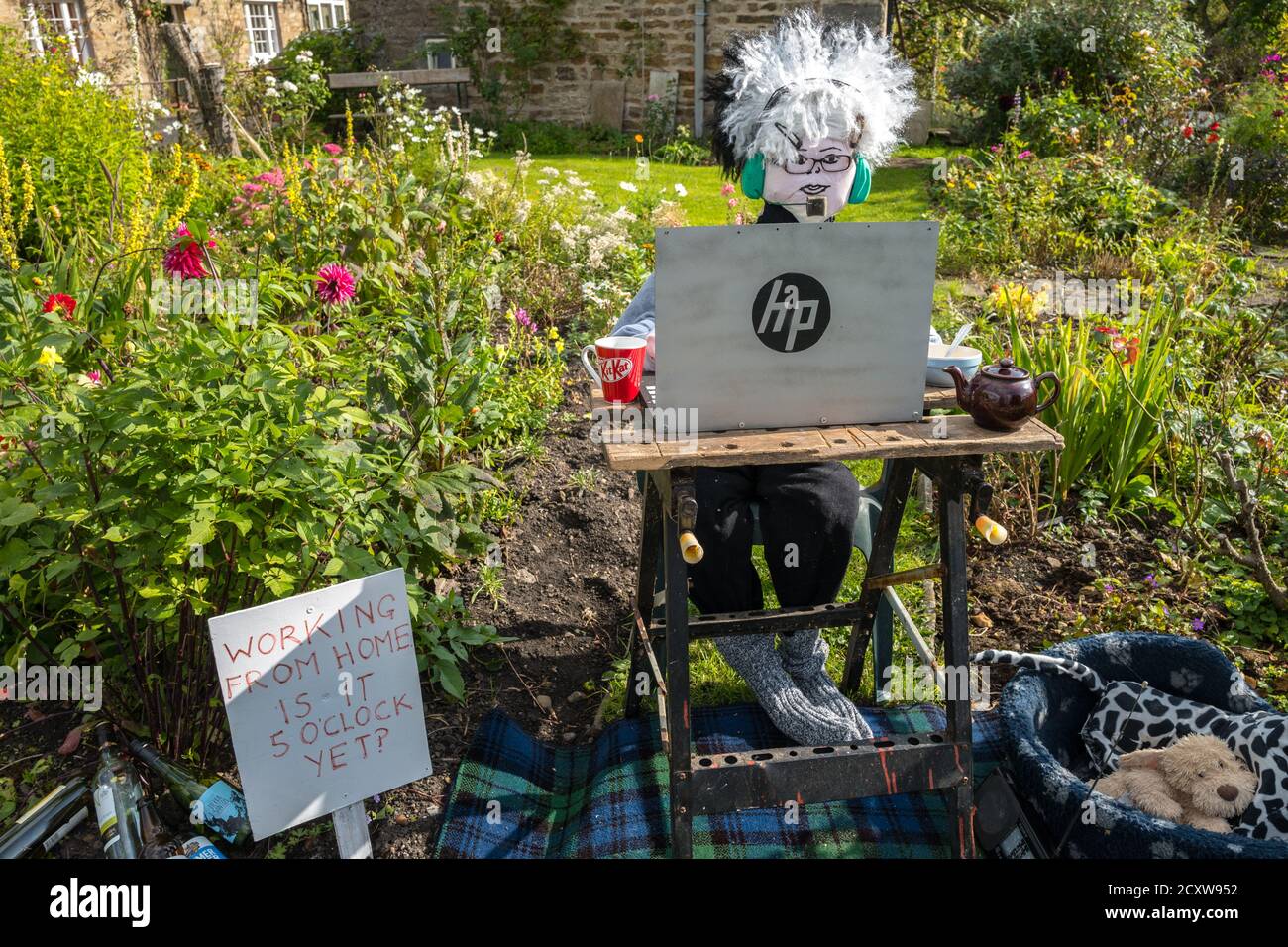 This years theme for the Yorkshire Dales village of Redmire annual scarecrow competition being Covid 19 and the Lockdown. Stock Photo