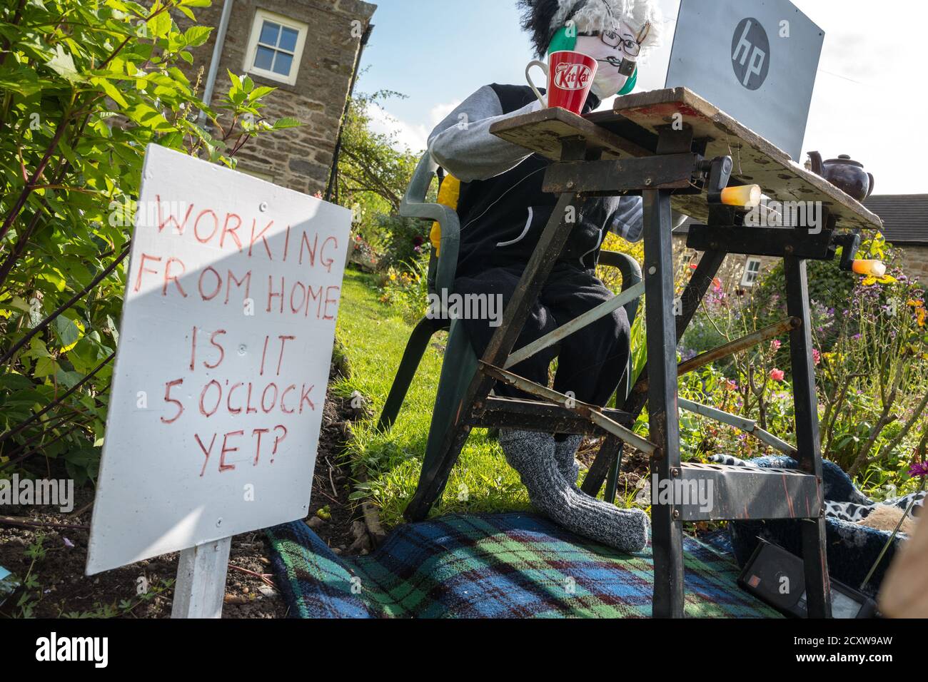 This years theme for the Yorkshire Dales village of Redmire annual scarecrow competition being Covid 19 and the Lockdown. Stock Photo