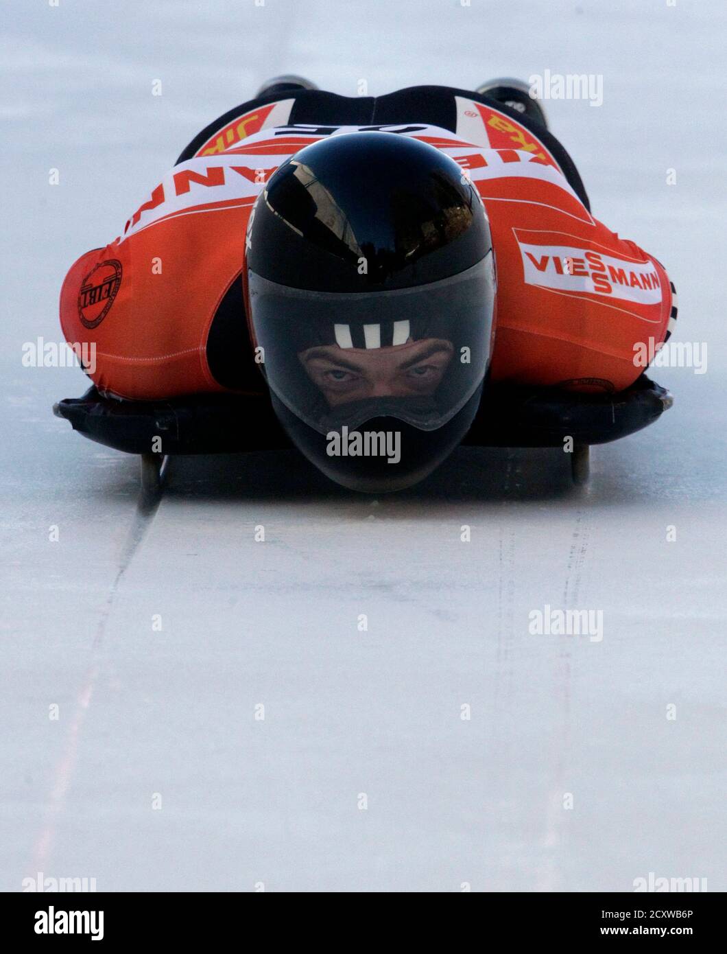 Ben Sandford of New Zealand speeds down the first run to finish thrid of the men's skeleton event at the FIBT World Cup in St. Moritz January 28, 2011.  REUTERS/Denis Balibouse (SWITZERLAND - Tags: SPORT SKELETON) Stock Photo