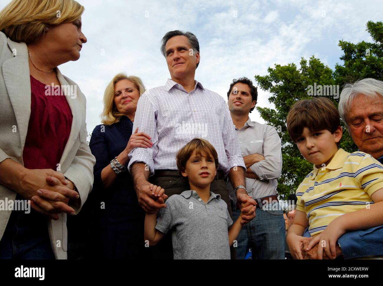 Republican presidential candidate and former Massachusetts Governor Mitt  Romney is joined by his wife Ann (2nd L), their son Craig (R) and their  grandson Parker (bottom) at a campaign stop in Hialeah,