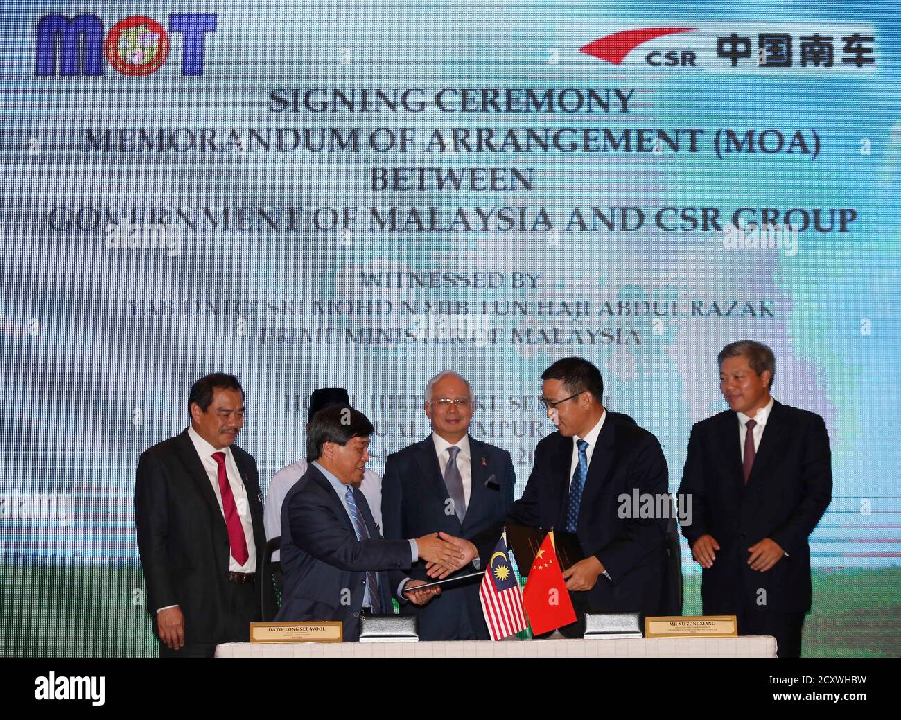 Secretary General Of Malaysia S Ministry Of Transport Mot Long See Wool Front L And Executive Director And President Of China Southern Railway Zhuzhou Electric Locomotive Co Ltd Csr Zelc Xu Zongxiang Front R