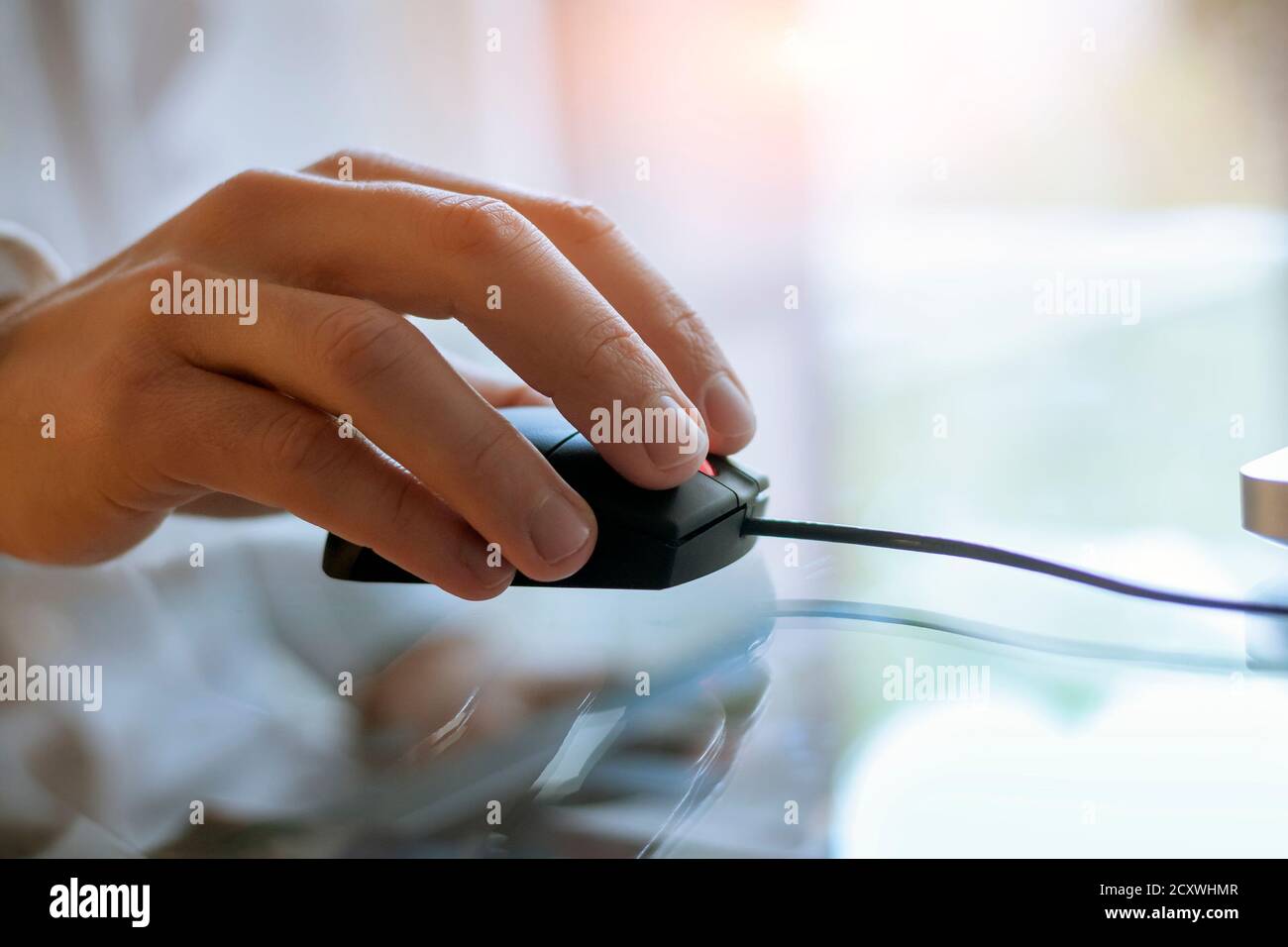Close-up of laptop mouse and hand Stock Photo