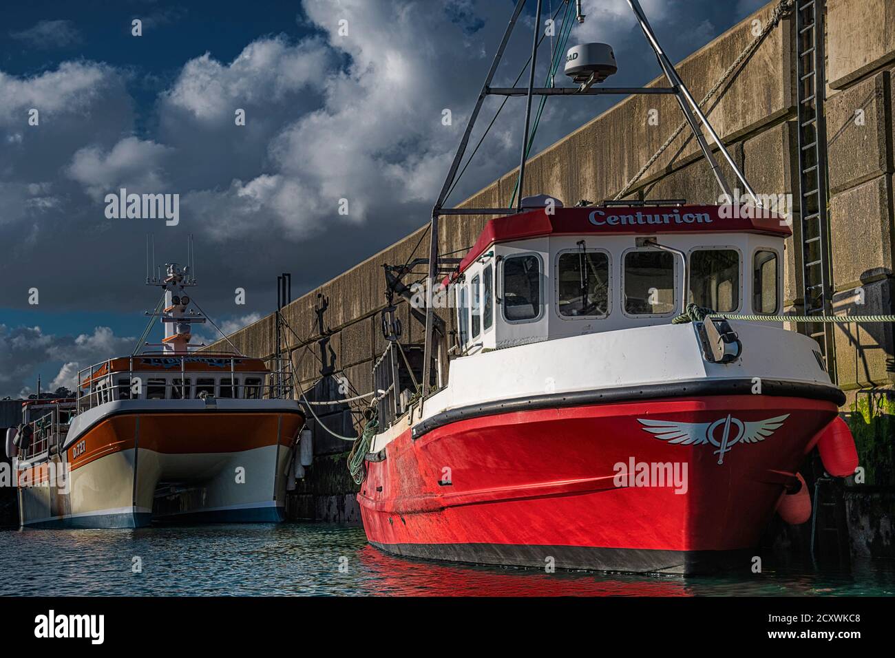 Fishing boat tied to pier hi-res stock photography and images - Alamy