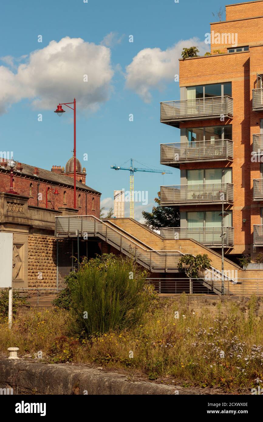 View of buildings and a crane at the North side of Crown Point Bridge, Leeds Stock Photo