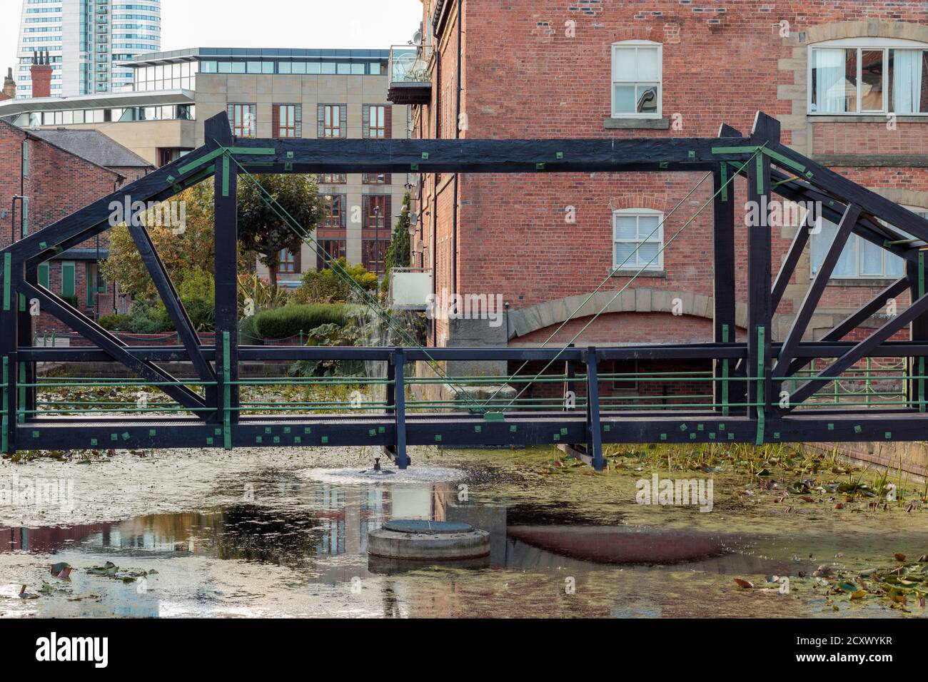 View of pedestrian footbridge built over the canal to apartments off Dock Street, Leeds Stock Photo