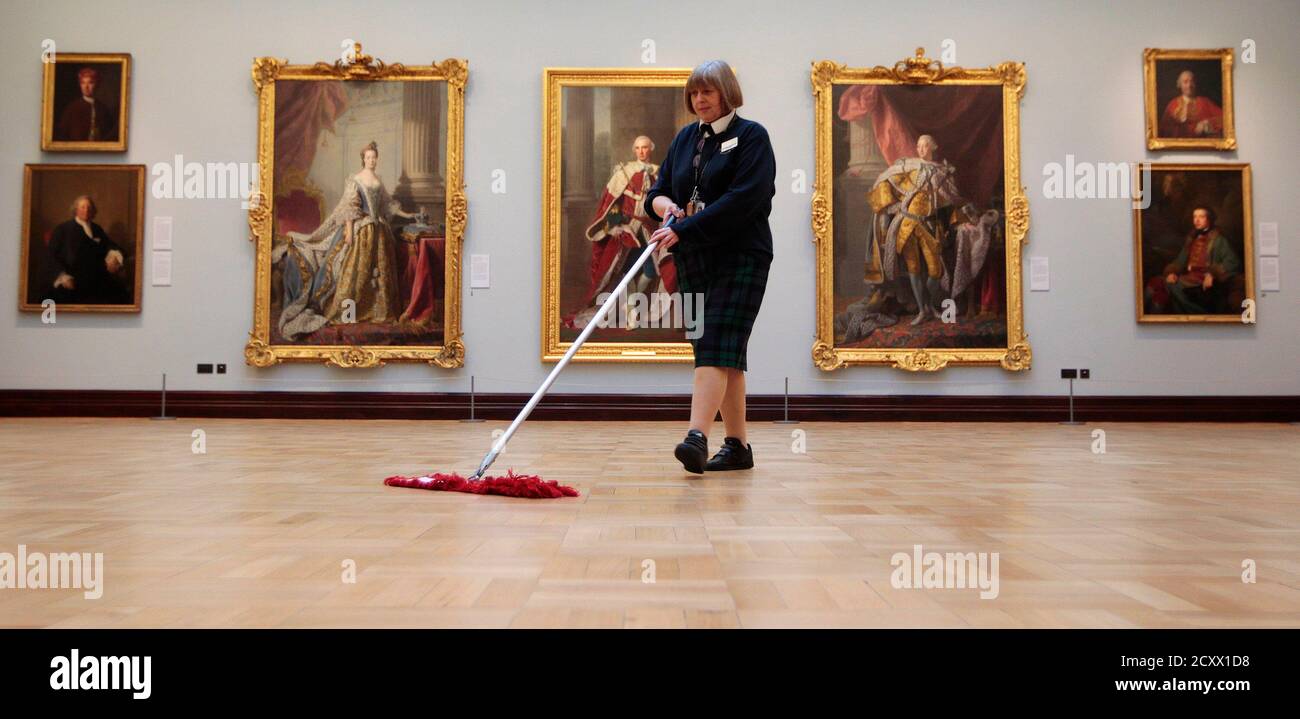 Gallery assistant Heather Bundy sweeps the floor of the Jacobite Room  during a special viewing of the Scottish National Portrait Gallery in  Edinburgh, Scotland November 28, 2011. The gallery is to open