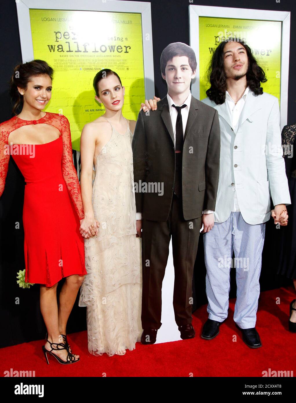 Cast Members Nina Dobrev L Emma Watson C And Ezra Miller Pose With A Life Size Cardboard Figure Of Co Star Logan Lerman At The Premiere Of The Perks Of Being A Wallflower At Cast Members Nina Dobrev L Emma Watson C And Ezra Miller Pose With A Life Size Cardboard Figure Of Co Star Logan Lerman At The Premiere Of The Perks Of Being A Wallflower At