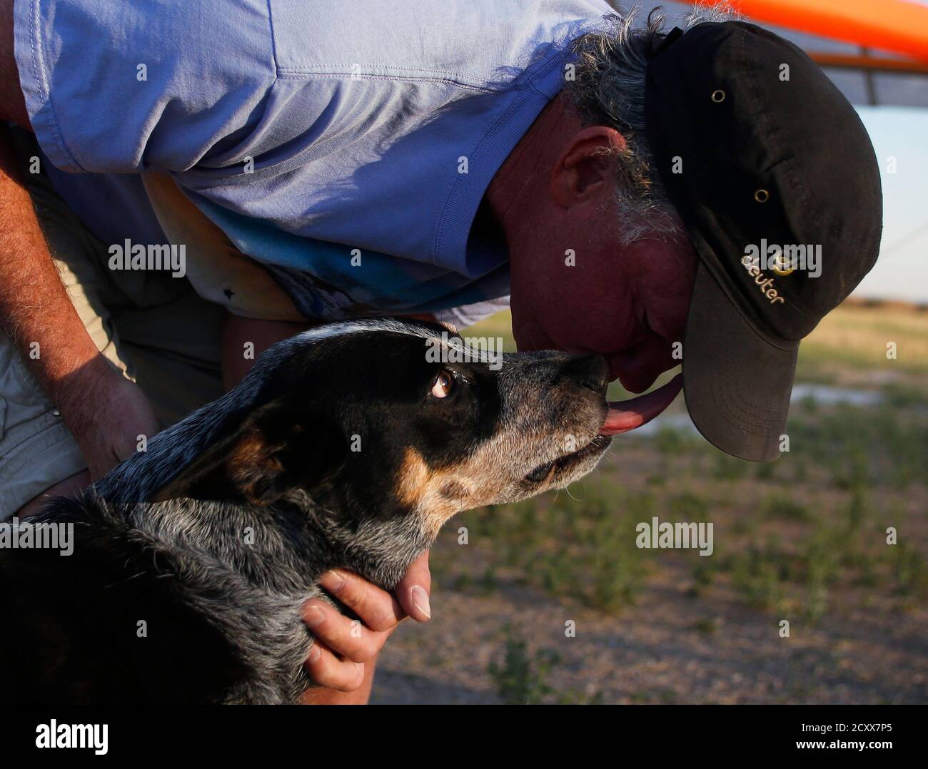 Dan McManus gets a kiss from his service dog Shadow after they flew in a hang glider together outside Salt Lake City, Utah, July 22, 2013. McManus suffers from anxiety and Shadow's Dan McManus gets a kiss from his service dog Shadow after they flew in a hang glider together outside Salt Lake City, Utah, July 22, 2013. McManus suffers from anxiety and Shadow's