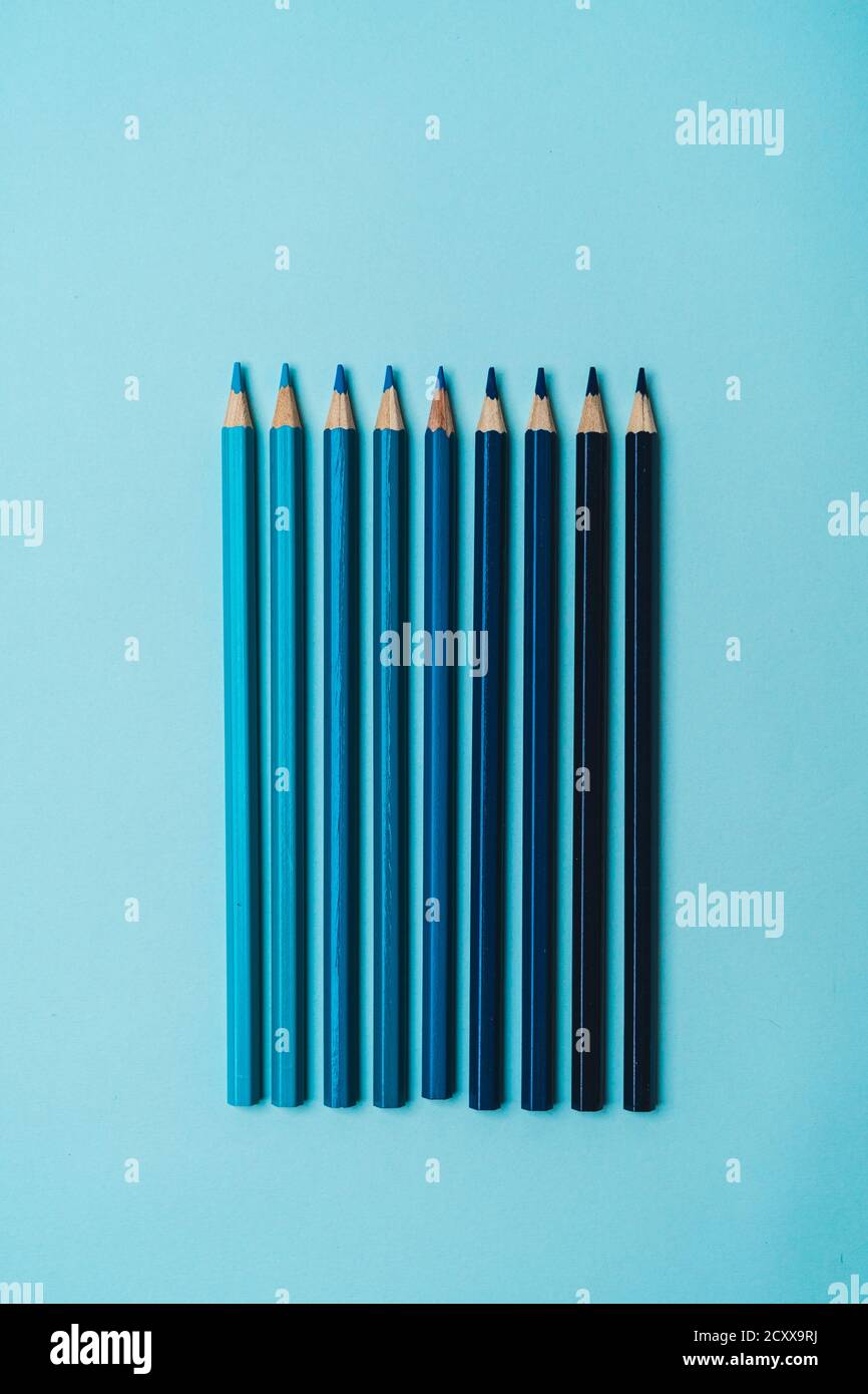 Stationery - book, pencil, ruler on a blue background Stock Photo - Alamy
