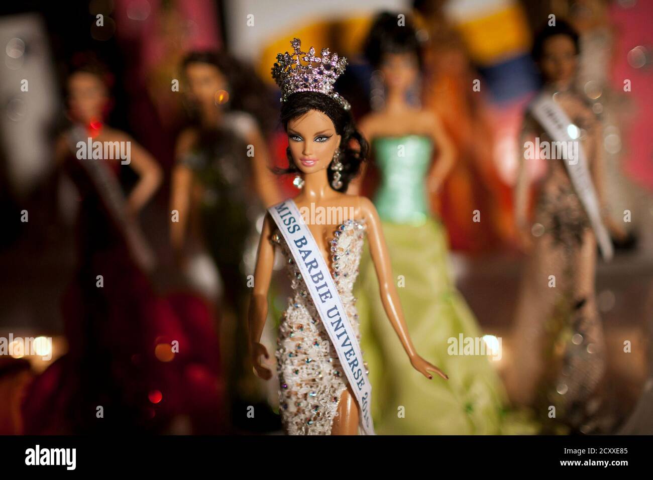 Barbie doll "Reina Bella Guerrero", the Miss Barbie Universe 2010 is shown  on the stage during the Miss Barbie Venezuela 2010 beauty pageant in  Caracas December 11, 2010. Contestants adorn their dolls,