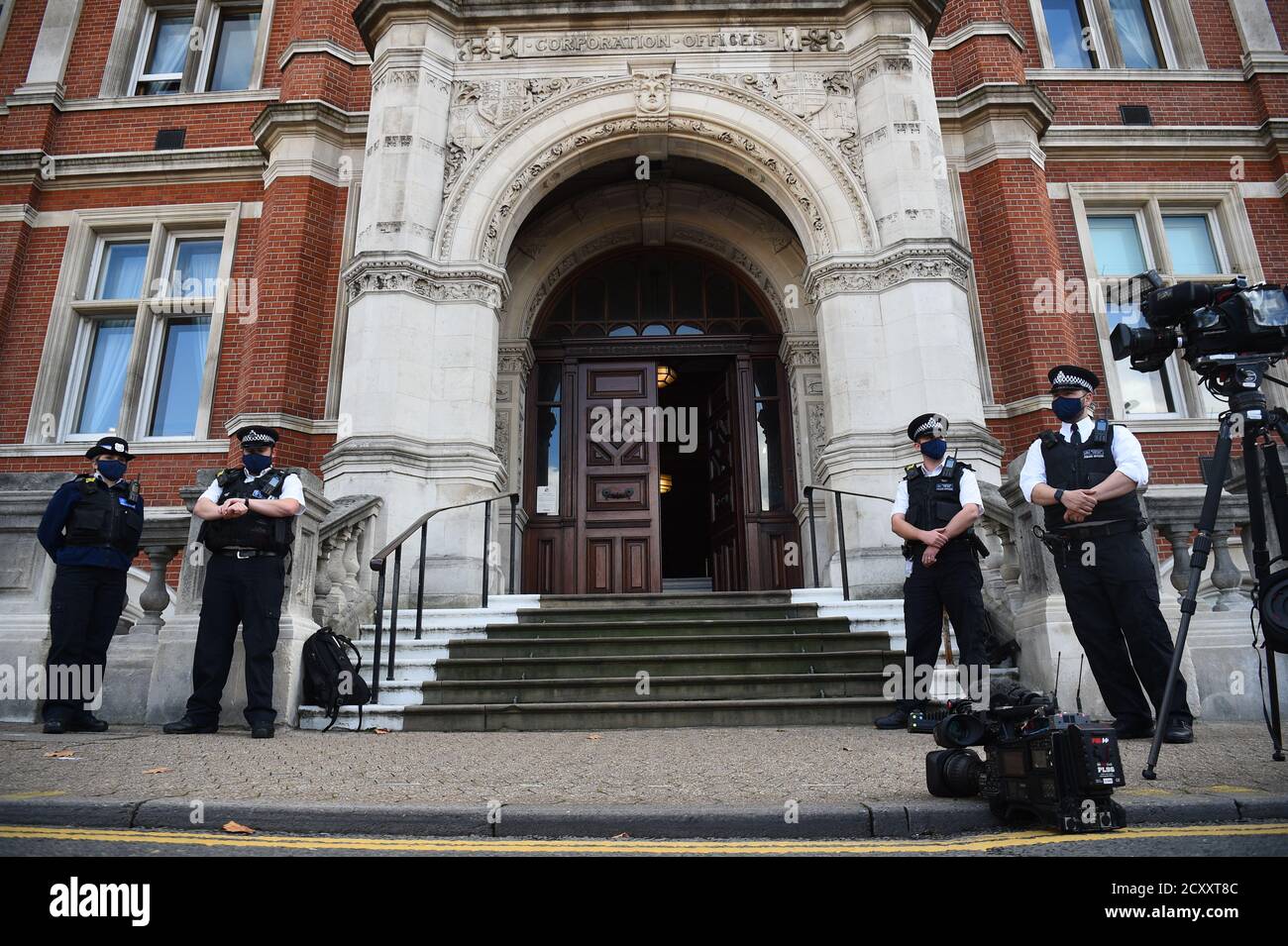 Police Officers outside Croydon Town Hall, south London, ahead of the opening of the inquest into the death of police officer Sergeant Matt Ratana. Ratana died from a gunshot wound to the chest after being injured at Croydon Custody Centre, according to a preliminary post-mortem examination report read at Croydon Coroner's Court. Stock Photo
