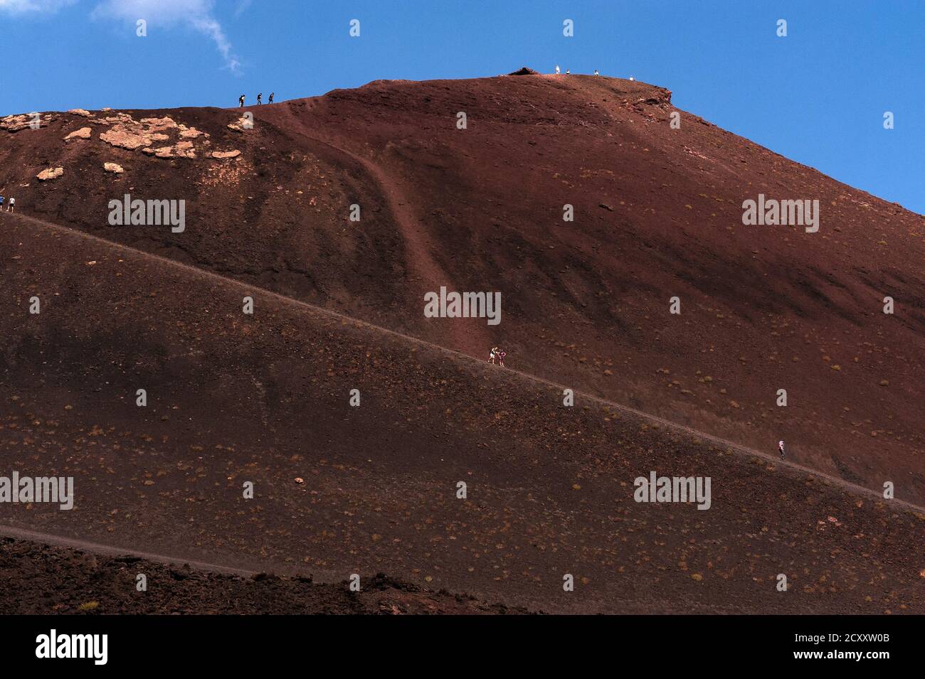Tourists face a long climb up a manmade ramp to walk the rim of one of
