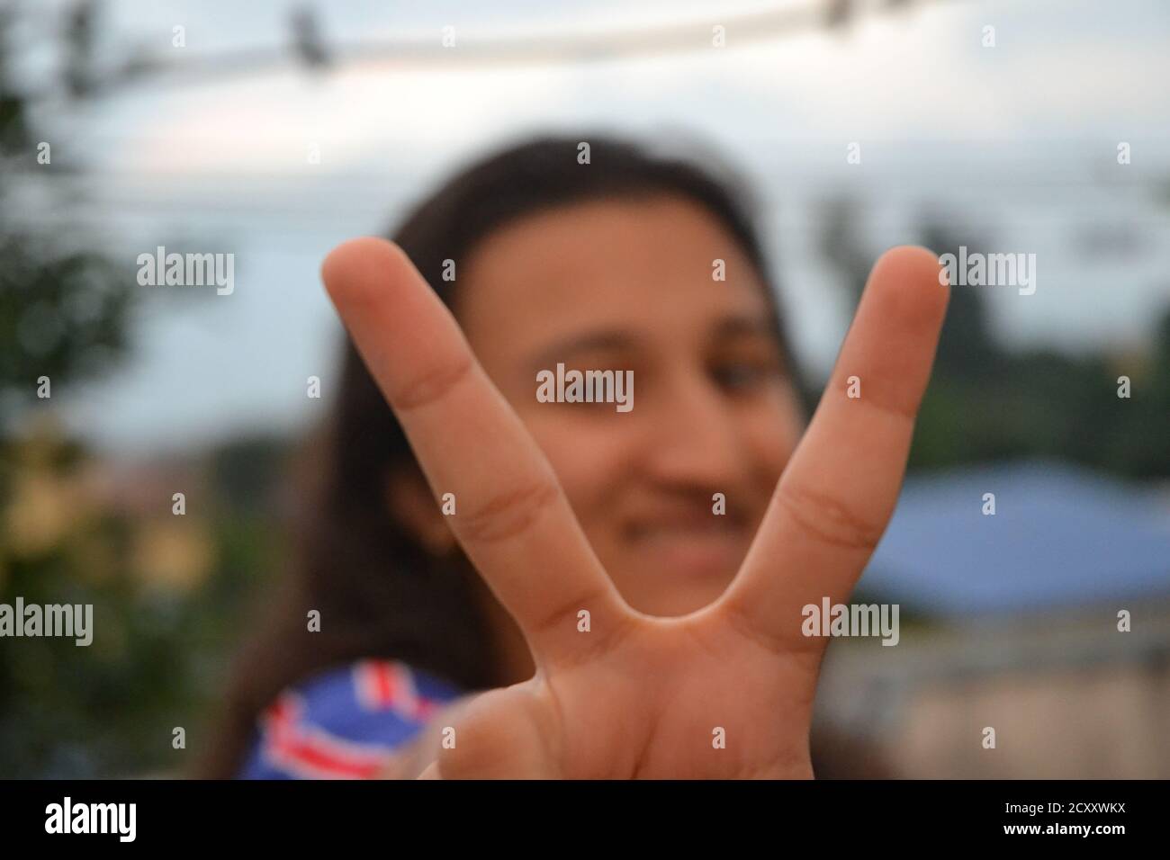 A South Asian girl shows some gestures. Stock Photo