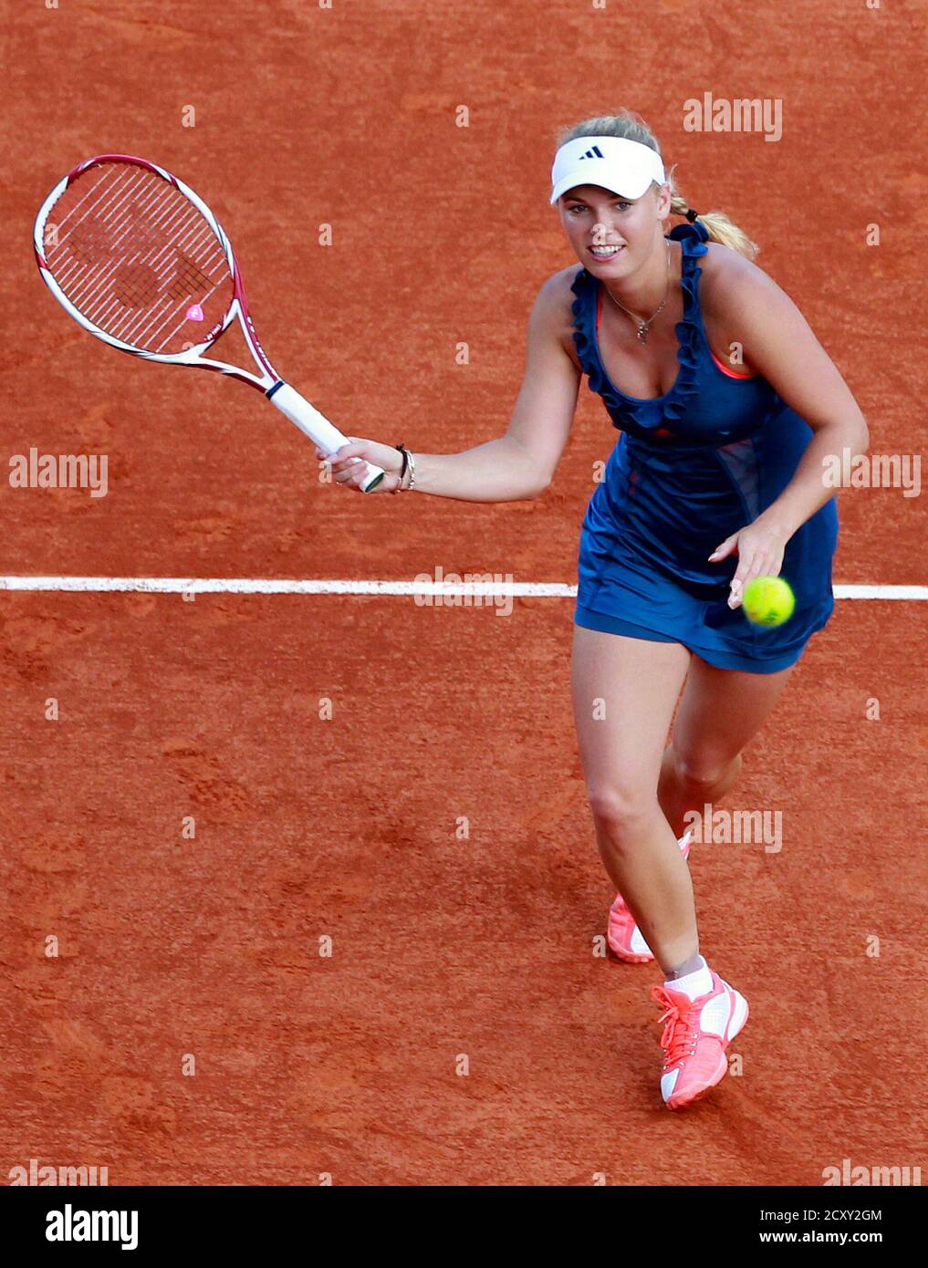 Caroline Wozniacki of Denmark returns the ball to Italy's Francesca  Schiavone during an exhibition match in the first round of the Monte Carlo Masters  tennis tournament in Monaco April 11, 2011. REUTERS/Eric