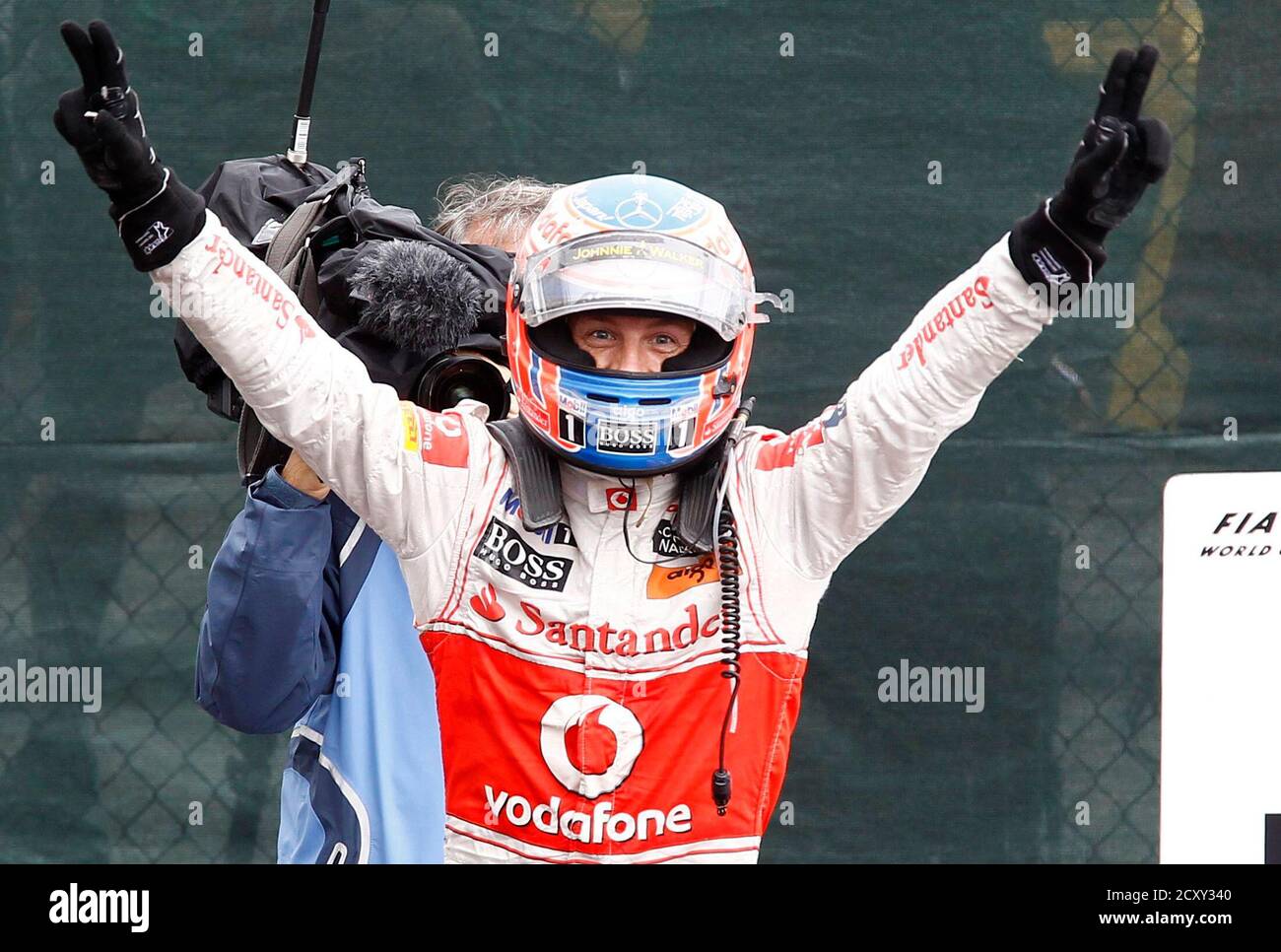 McLaren Formula One driver Jenson Button of Britain celebrates after winning the Canadian F1 Grand Prix at the Circuit Gilles Villeneuve in Montreal June 12, 2011.    REUTERS/Chris Wattie (CANADA  - Tags: SPORT MOTOR RACING) Stock Photo