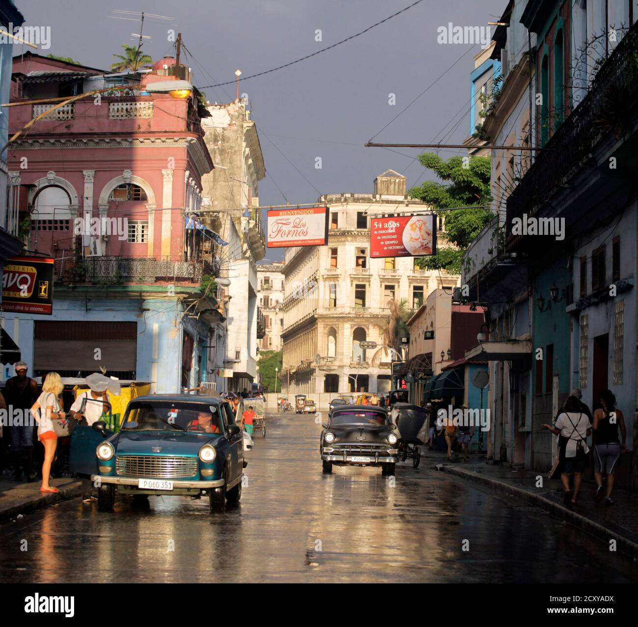 People Walk As Cars Are Driven On A Street In Havana September 30 2013 Reuters Desmond Boylan Cuba Tags Society Transport Cityscape Stock Photo Alamy