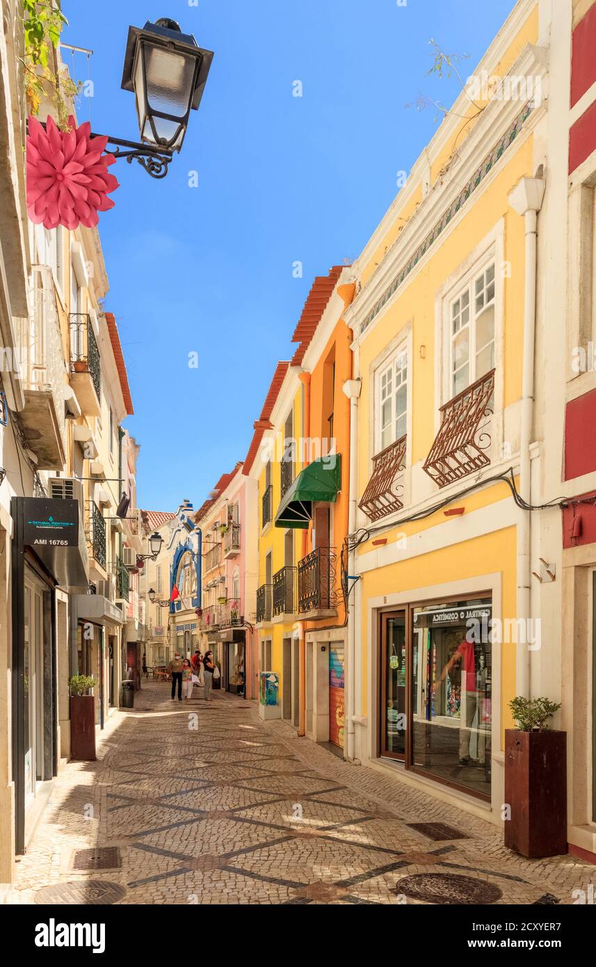 Setúbal, Portugal - August 28, 2020: Beautiful street in the city center of Setúbal in Portugal, with colorful old buildings and commerce. Stock Photo