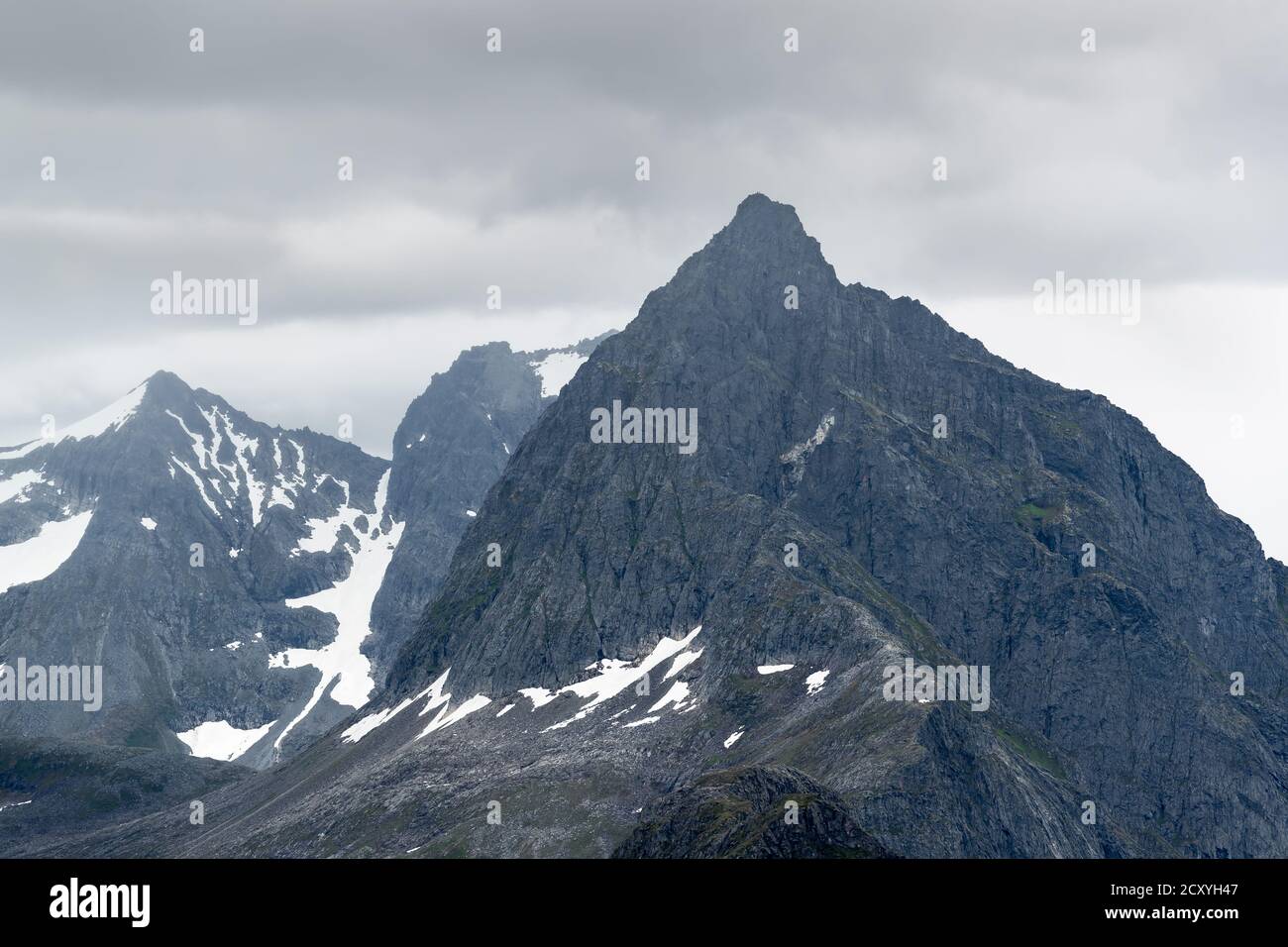 SLOGEN, NORWAY 2016 AUGUST 04. Norwegian mountains with famous Slogen mountain with dark clouds Stock Photo