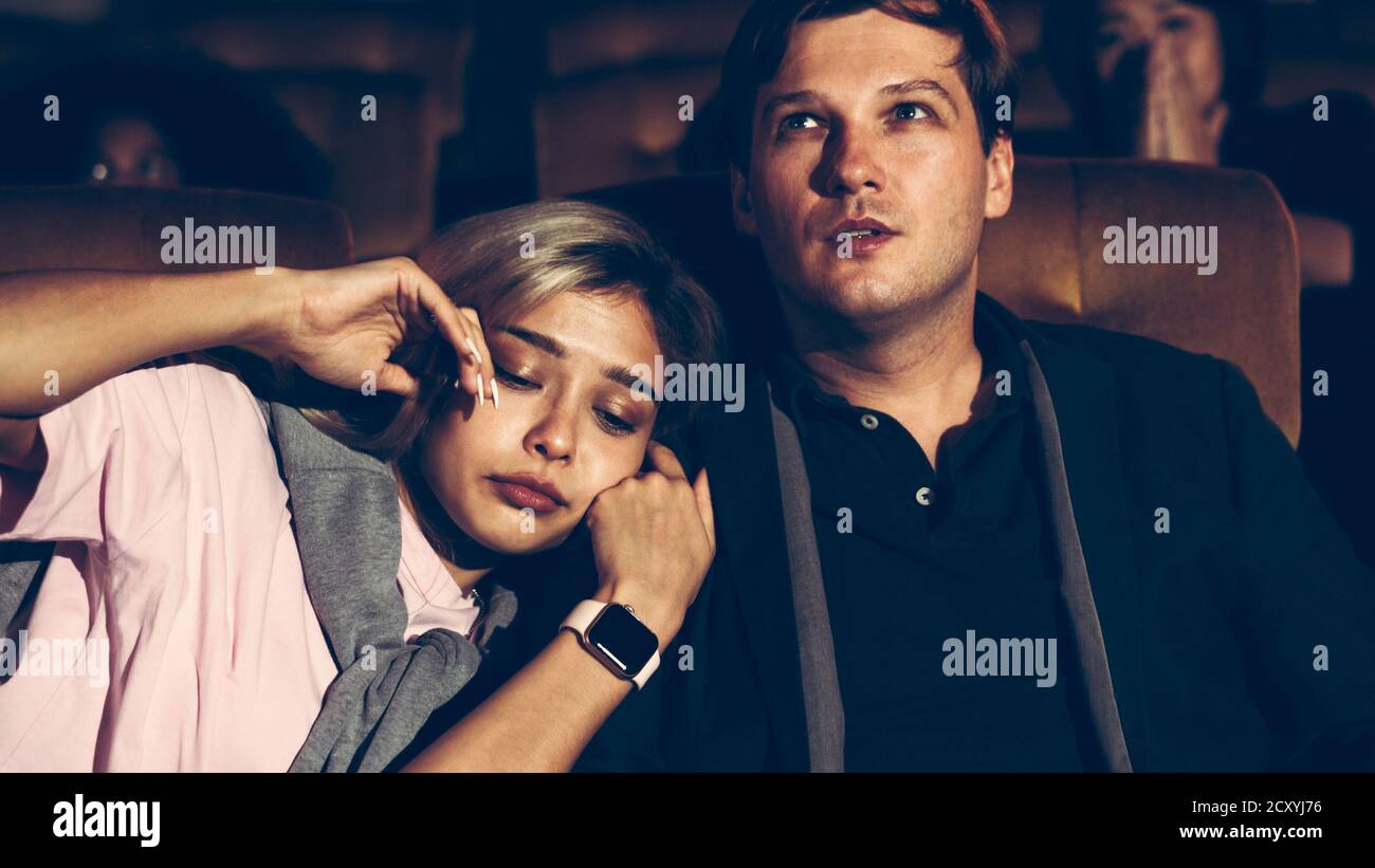 People audience watching movie in the movie theater cinema. Group