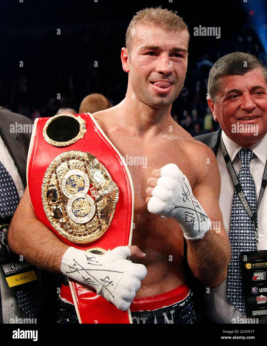 IBF Super Middleweight champion Lucian Bute of Romania poses with his belt  after defeating Glen Johnson of Jamaica during their IBF Super Middleweight  championship fight at the Colisee de Quebec in Quebec