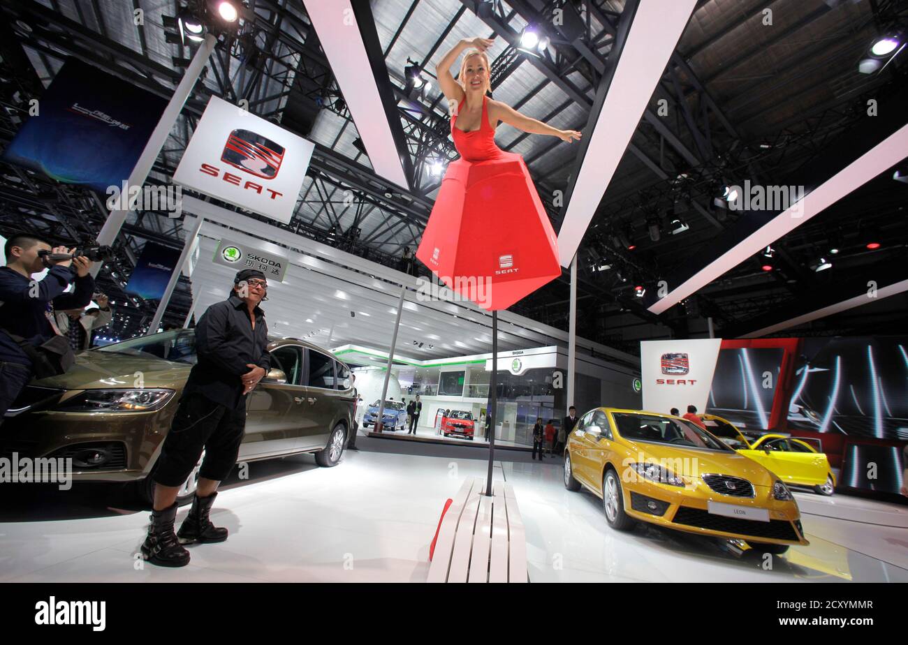 A model performs at a SEAT booth at Auto China 2012 in Beijing April 24, 2012. China's massive car market may still be young, but the auto industry CEOs descending on Beijing this week will see first hand that it's also growing up fast.  REUTERS/Jason Lee (CHINA - Tags: TRANSPORT BUSINESS) Stock Photo