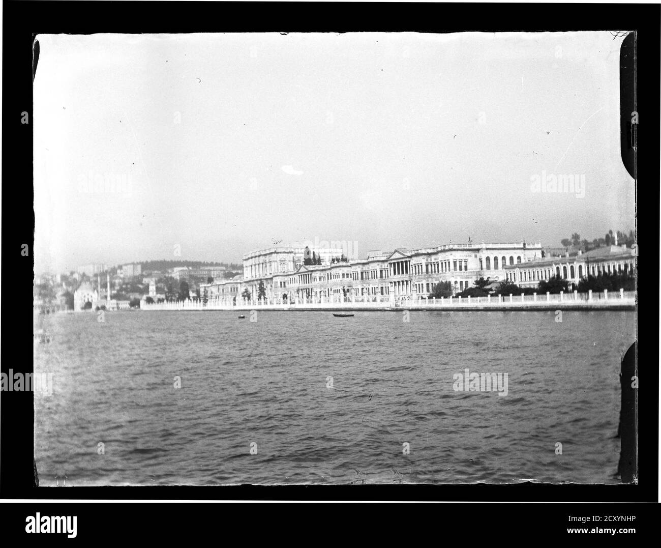 Turkey Istanbul Golden Horn Dolmabahçe Palace. Dolmabahçe Palace (Turkish: Dolmabahçe Sarayı) located in the Beşiktaş district of Istanbul, Turkey, on the European coast of the Strait of Istanbul, served as the main administrative center of the Ottoman Empire from 1856 to 1887 and from 1909 to 1922 (Yıldız Palace was used in the interim period). Photograph on dry glass plate from the Herry W. Schaefer collection, around 1910. Stock Photo