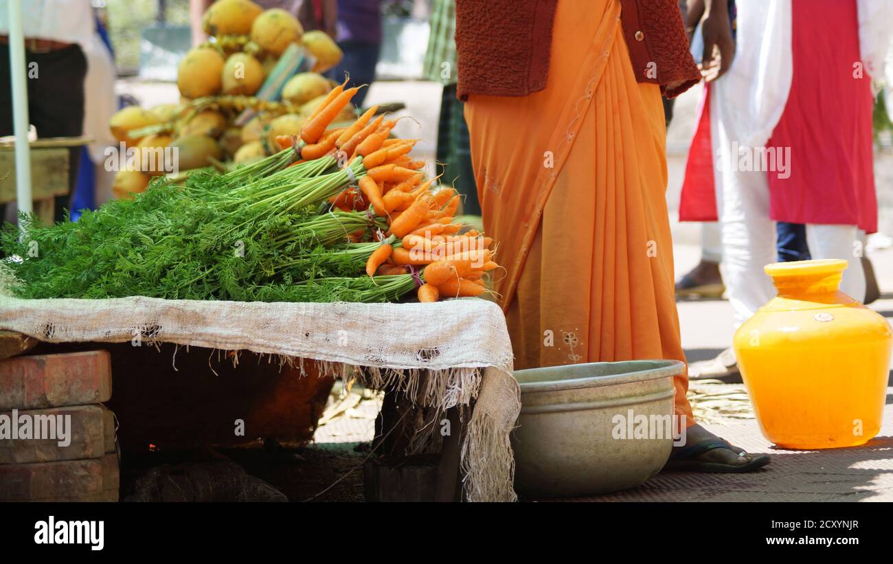 fresh carrots on market stall in India Stock Photo
