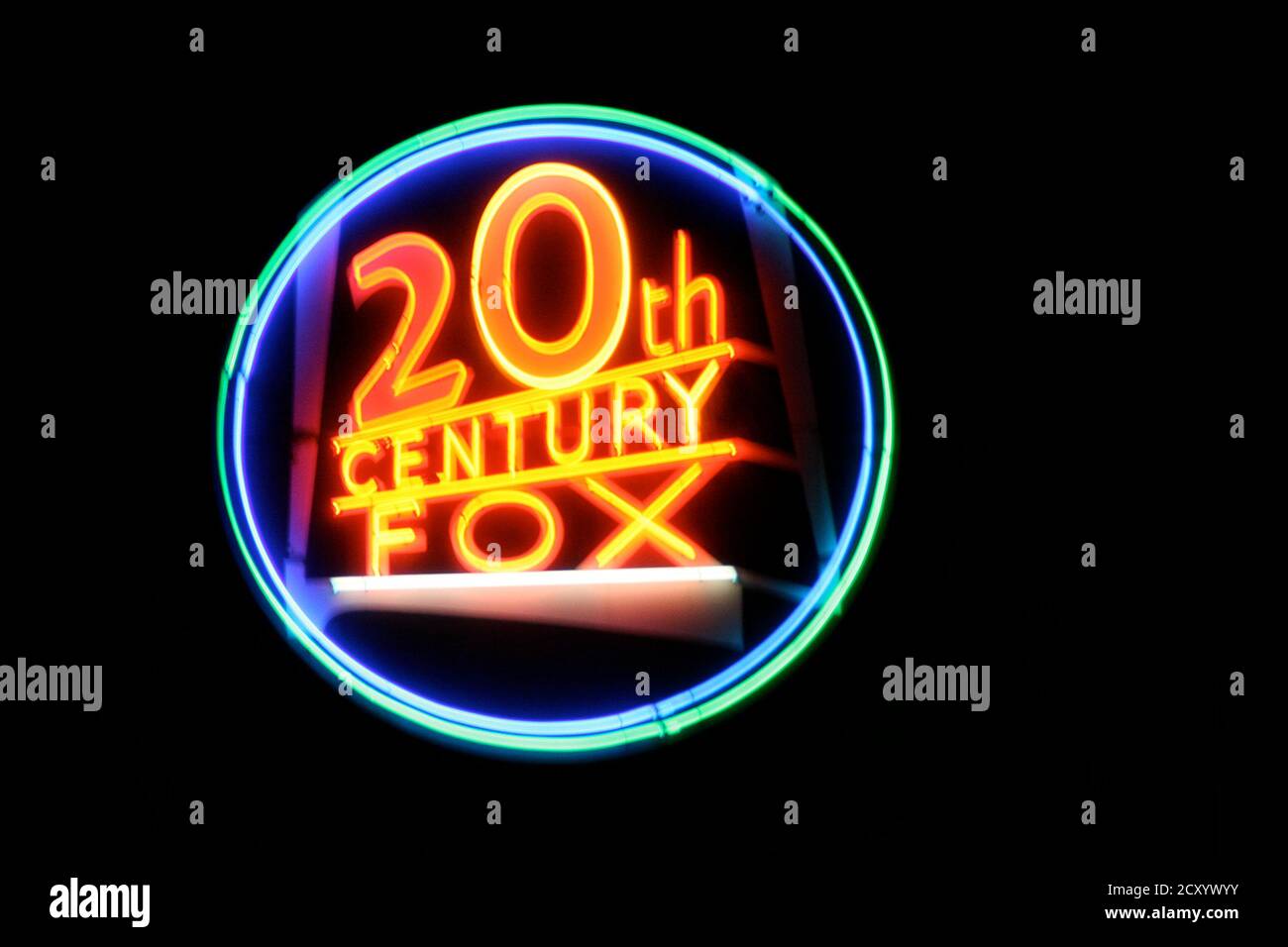 Close-up on a neon light shaped into the 20th Century Fox logo. Stock Photo