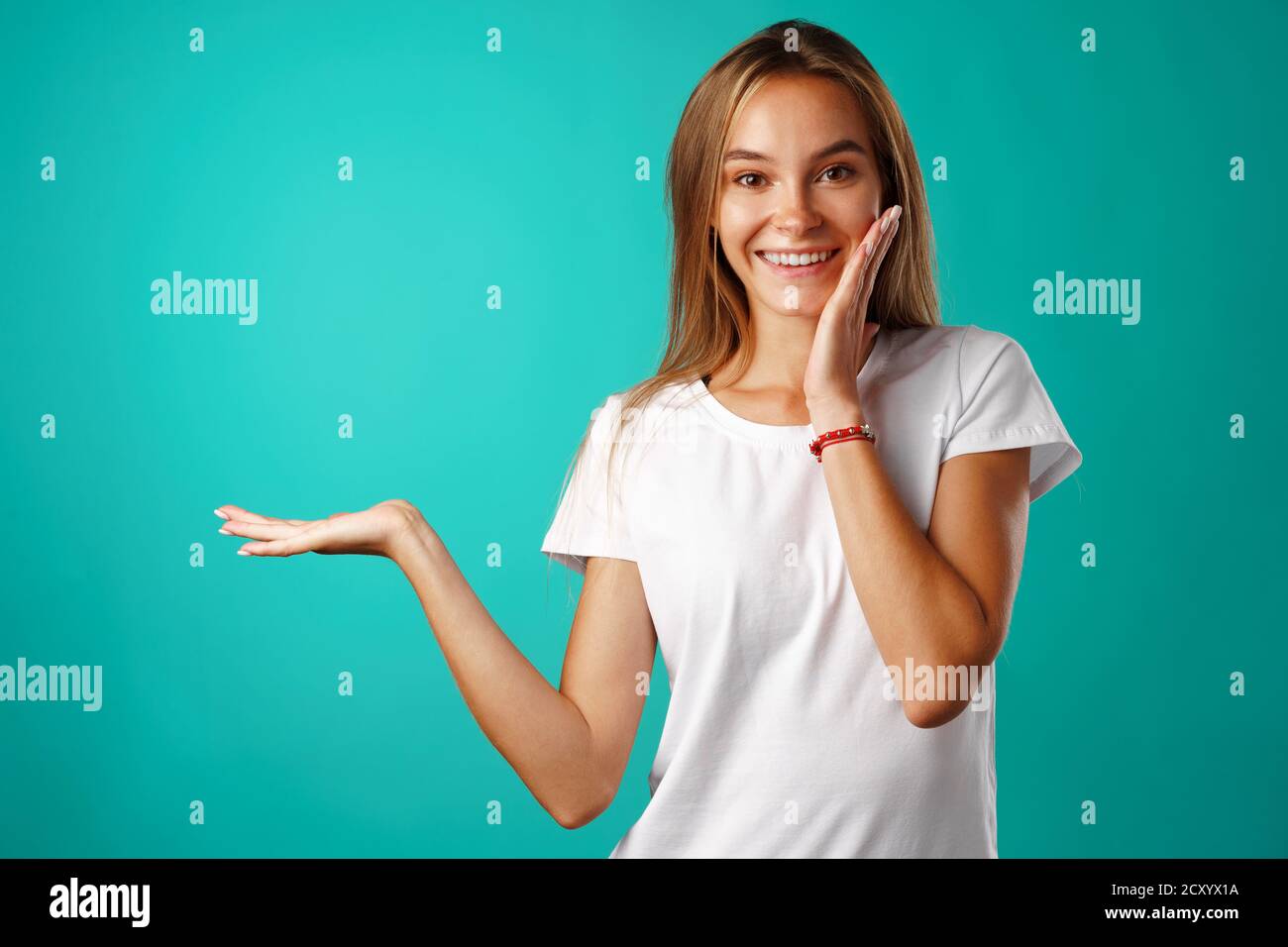 Portrait charming pretty cheerful girl showing copy space Stock Photo ...