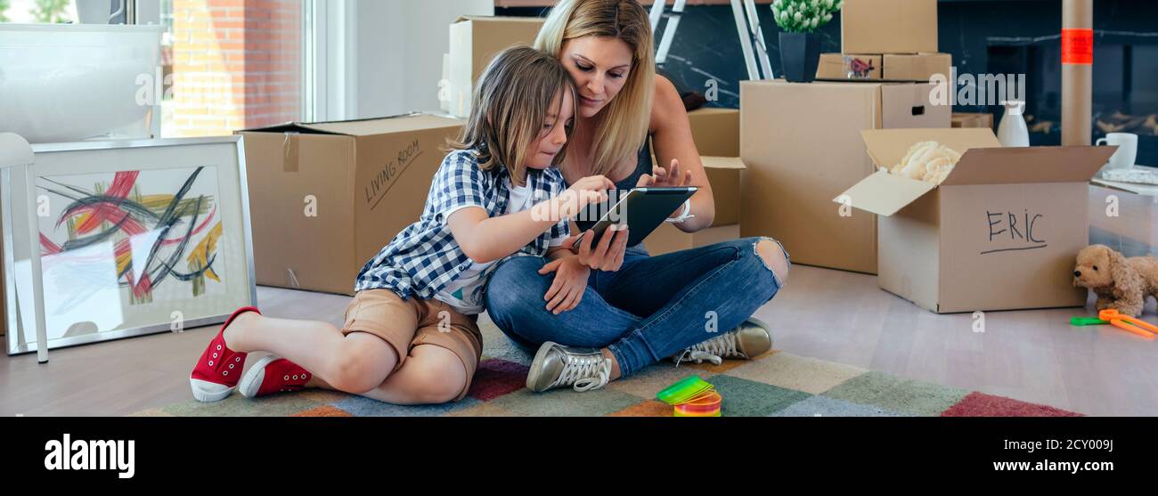 Mother and son playing the tablet Stock Photo