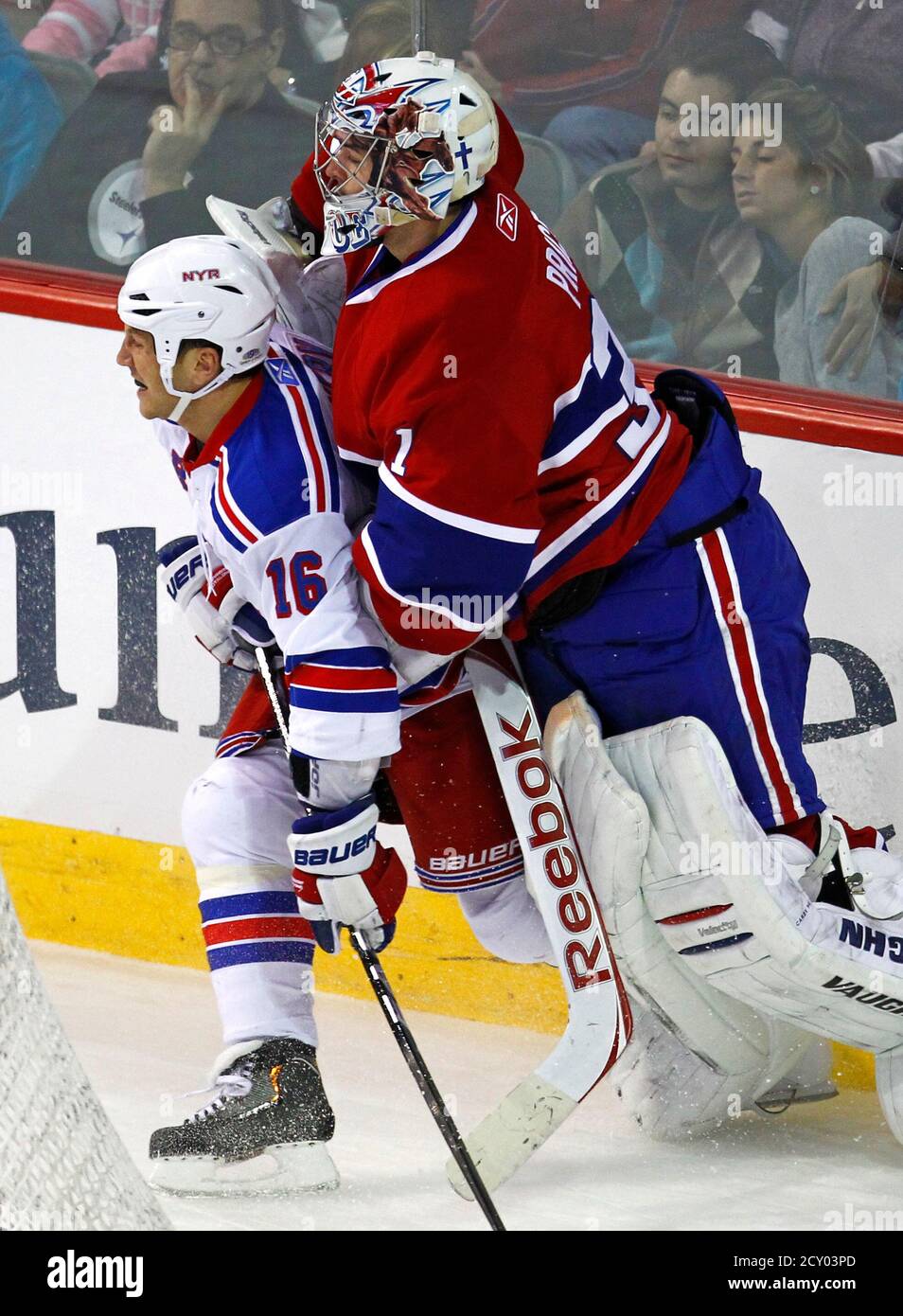 New York Rangers left wing Sean Avery (L) collides with Montreal Canadiens goalie Carey Price during the third period of their NHL hockey game in Montreal, February 5, 2011.   REUTERS/Shaun Best  (CANADA - Tags: SPORT ICE HOCKEY) Stock Photo