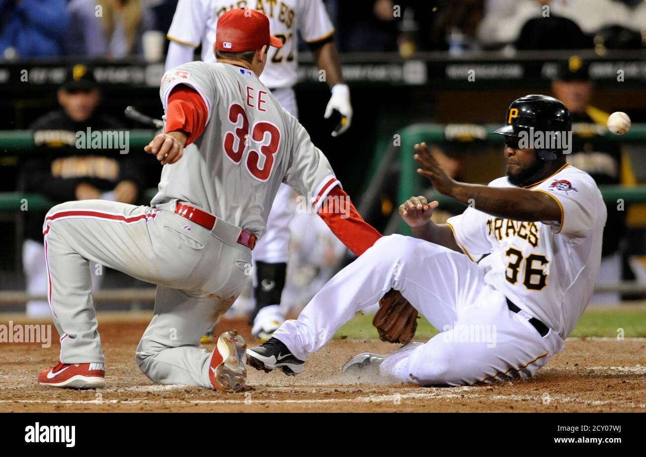 Pittsburgh Pirates Yamaico Navarro 36 Scores On A Wild Pitch By Philadelphia Phillies Pitcher Cliff Lee 33 In The Sixth Inning Of Their National League Mlb Baseball Game In Pittsburgh Pennsylvania April