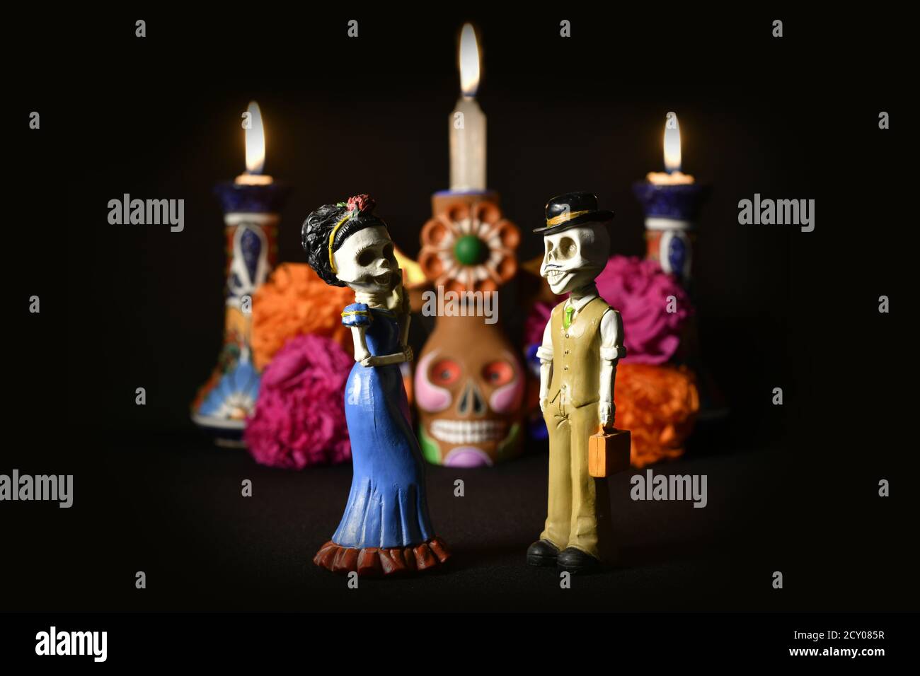 Closeup shot of plastic couple skull figurines for an offering of the day of the dead Stock Photo