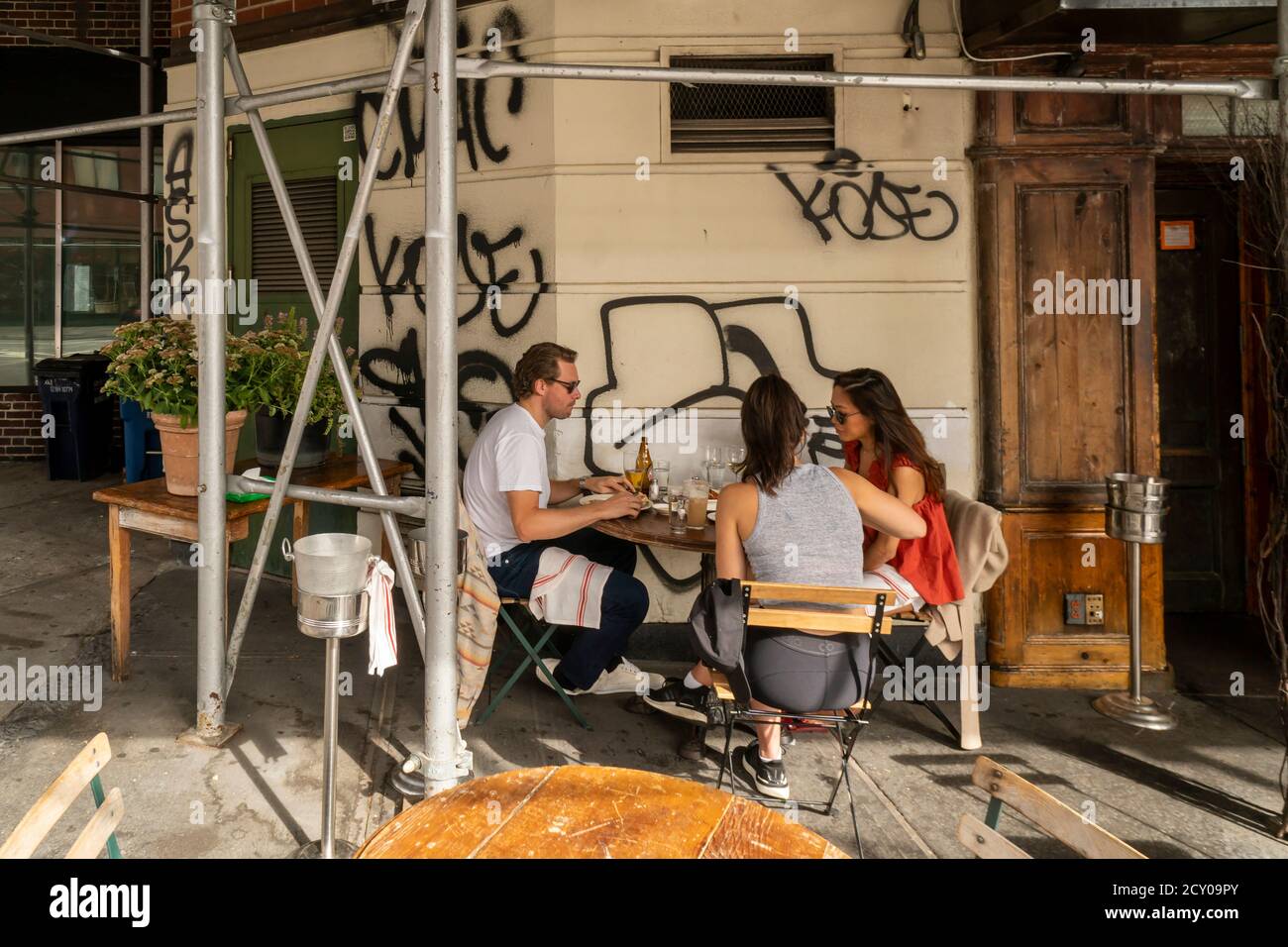 Al fresco dining under scaffolding in Greenwich Village in New York on