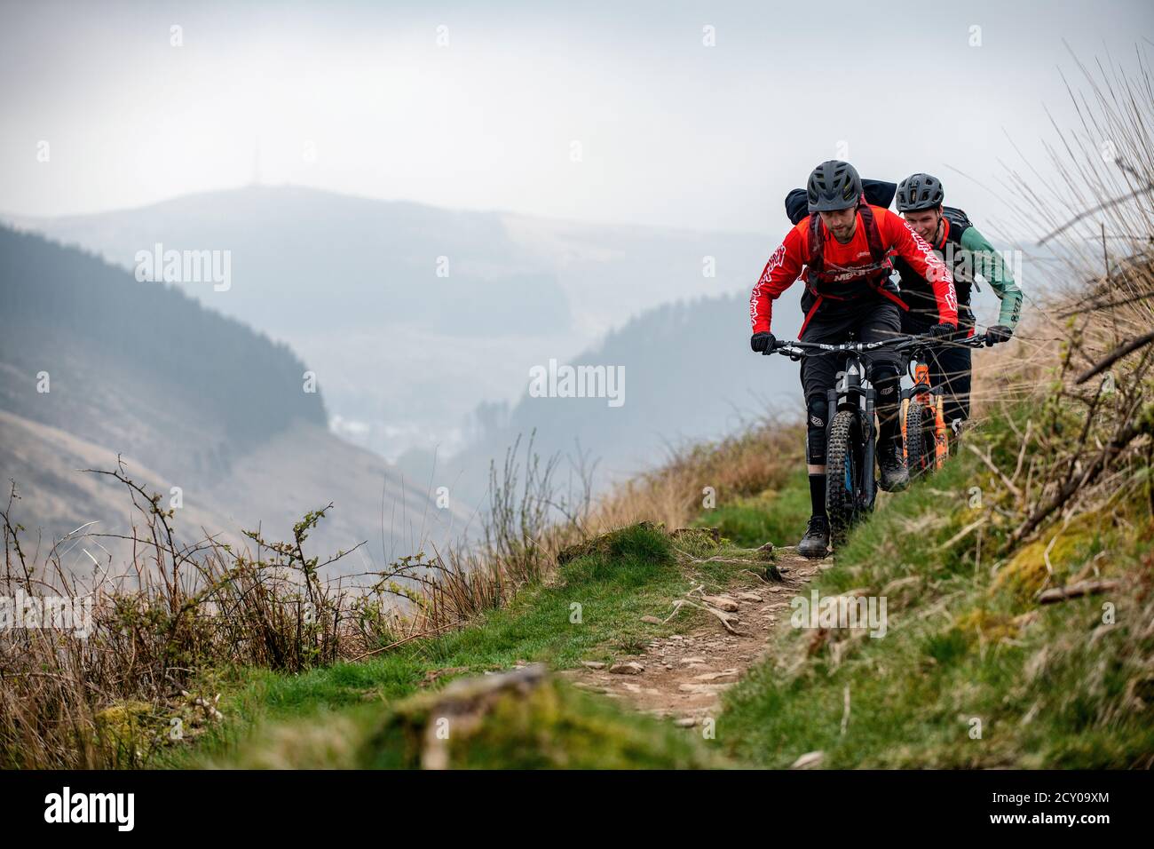 Two men ride mountain bikes on a trail at Glyncorrwg in the Afan Valley