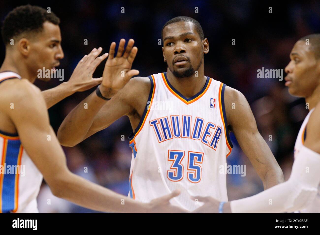 Oklahoma City Thunder forward Kevin Durant (C) celebrates a win over the Boston  Celtics with teammates Thabo Sefolosha of Switzerland (L) and Russell  Westbrook (R) after their NBA basketball game in Oklahoma