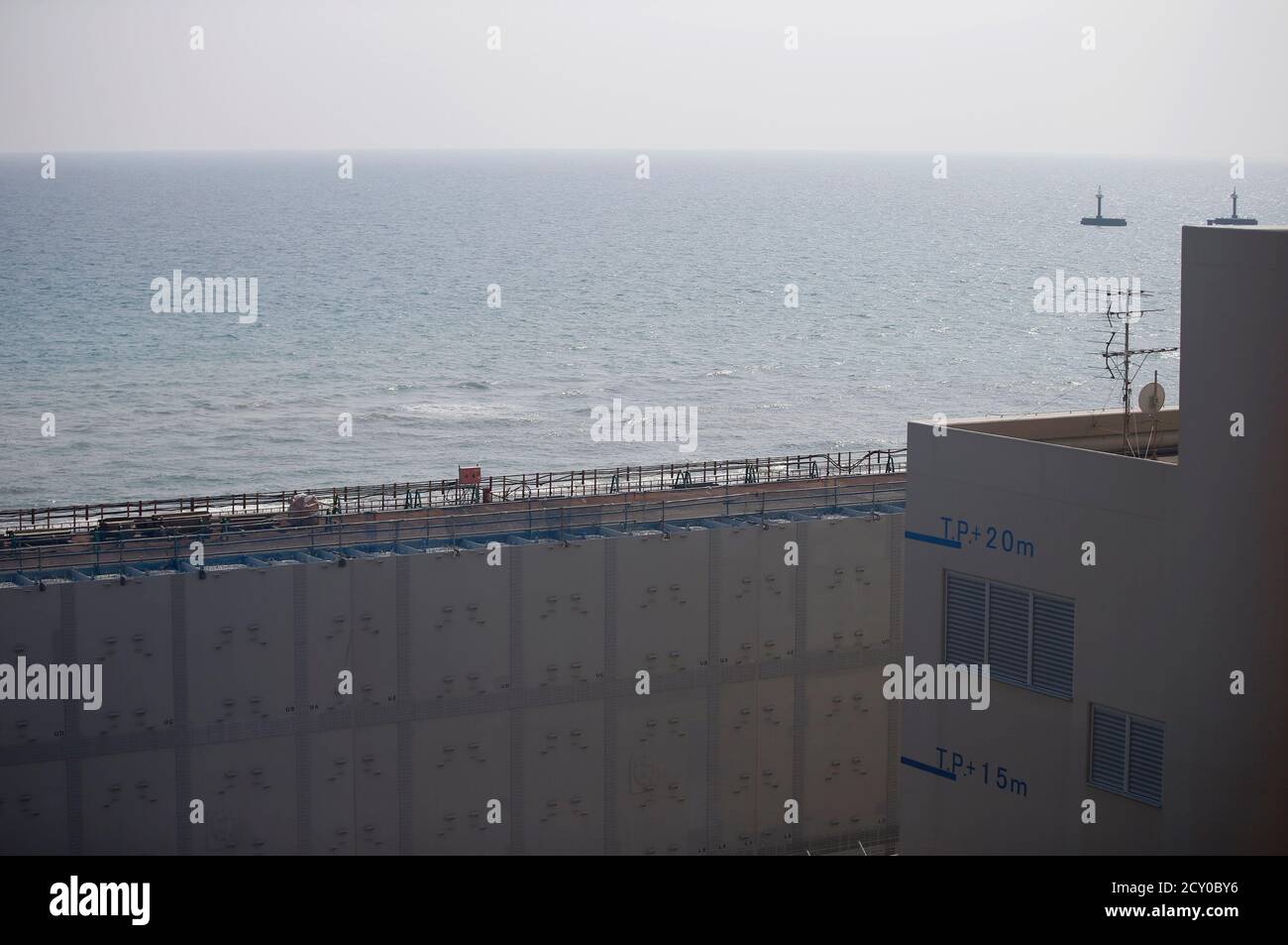 An 18 Meter 60 Ft High And 1 6 Km 1 Mile Long Tsunami Defence Wall Is Seen In Front Of Two Water Intake Towers At Chubu Electric Power Co S Hamaoka Nuclear Power Station