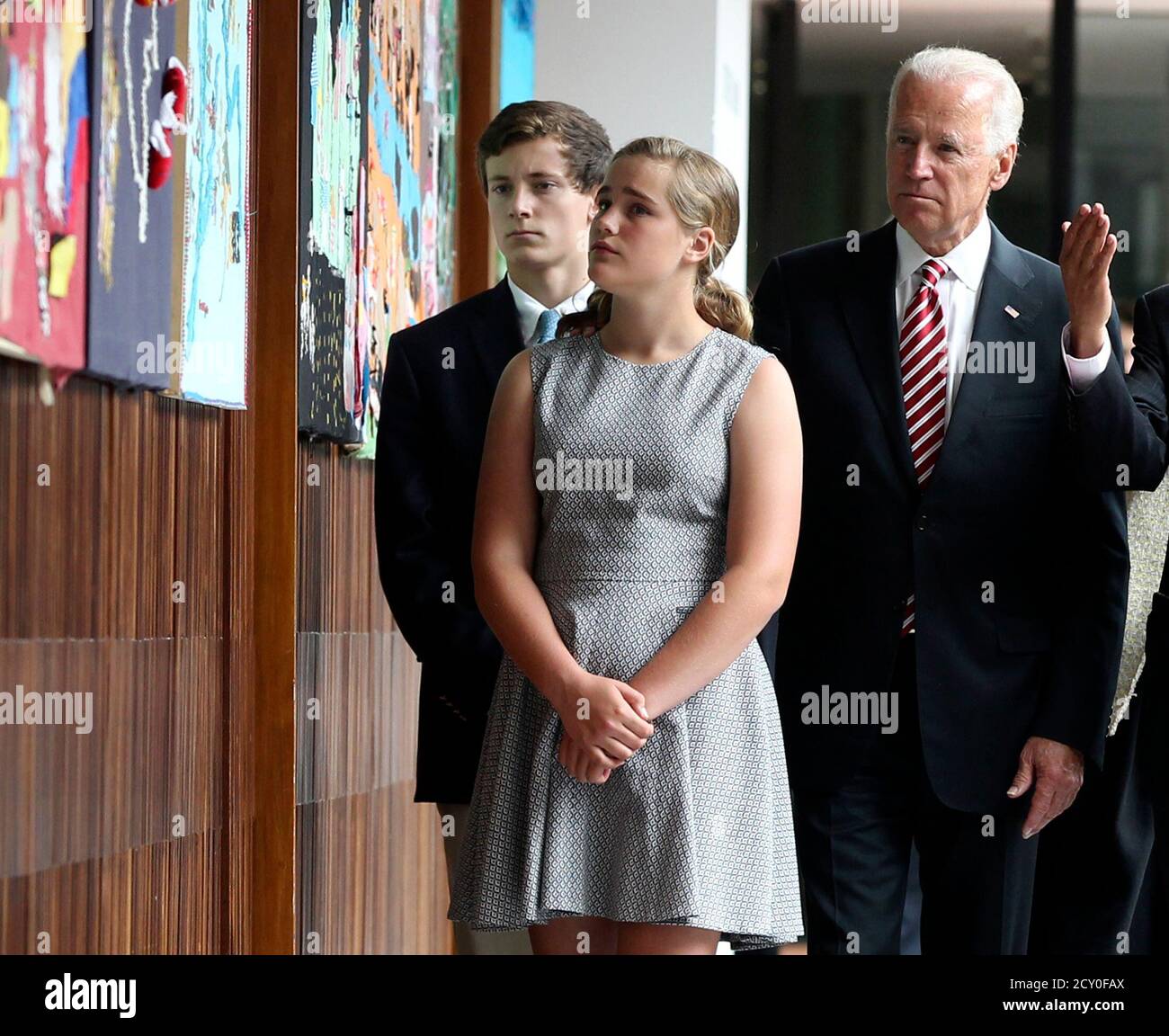 U.S. Vice President Joe Biden (R) arrives with his granddaughter Maisy Biden and nephew Nick Biden at the Center for Memory, Peace and Reconciliation in Bogota June 18, 2014. REUTERS/John Vizcaino (COLOMBIA - Tags: POLITICS) Stock Photo
