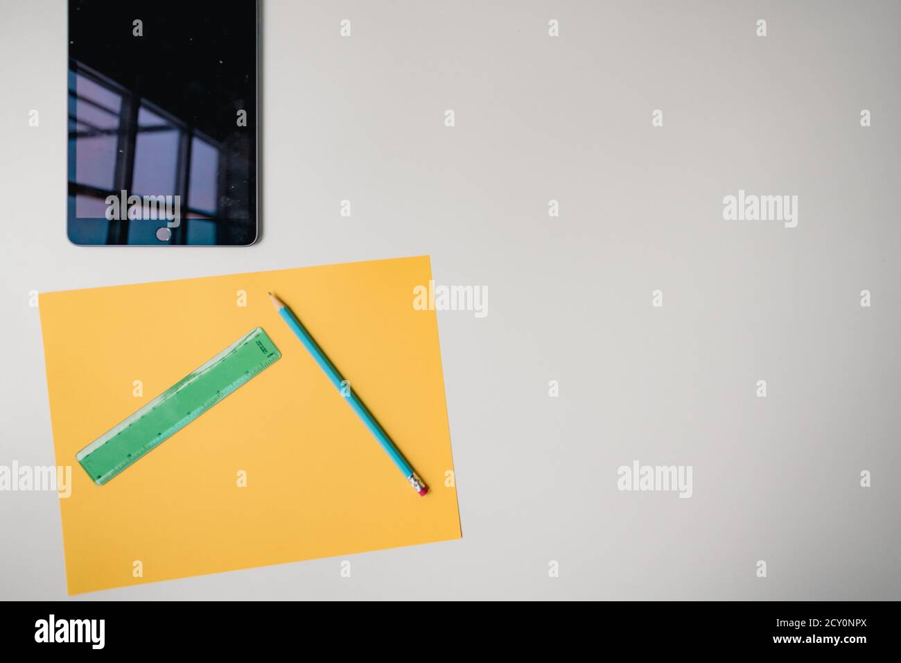 distance learning tablet and materials on white background Stock Photo