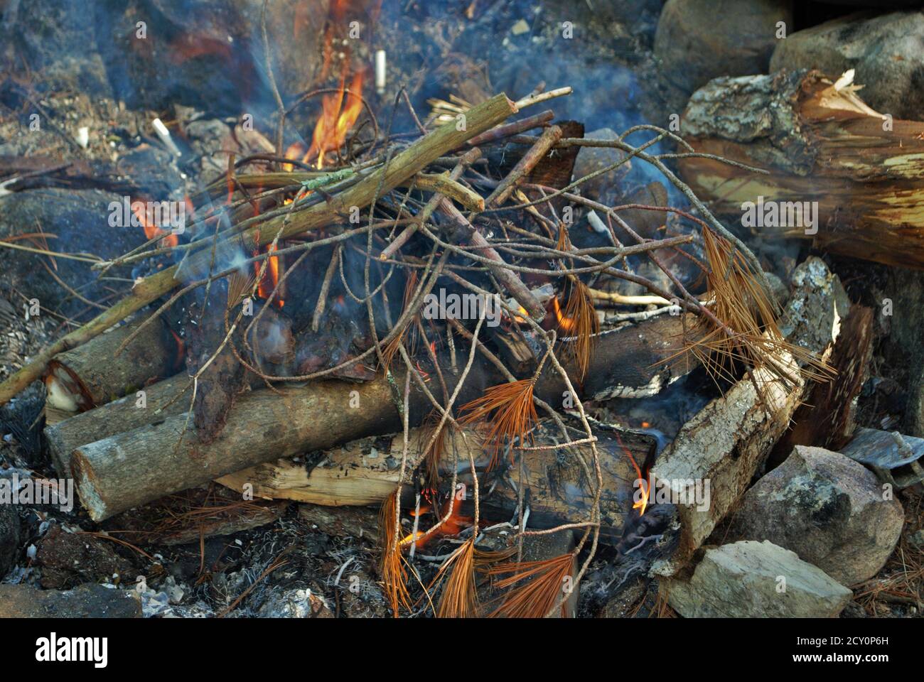 camp fire burning in a fire pit Stock Photo Alamy
