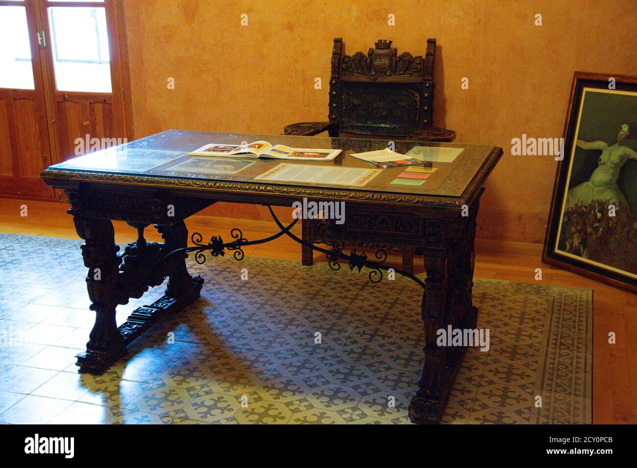 office desk table made of wood and ocher wall Stock Photo - Alamy