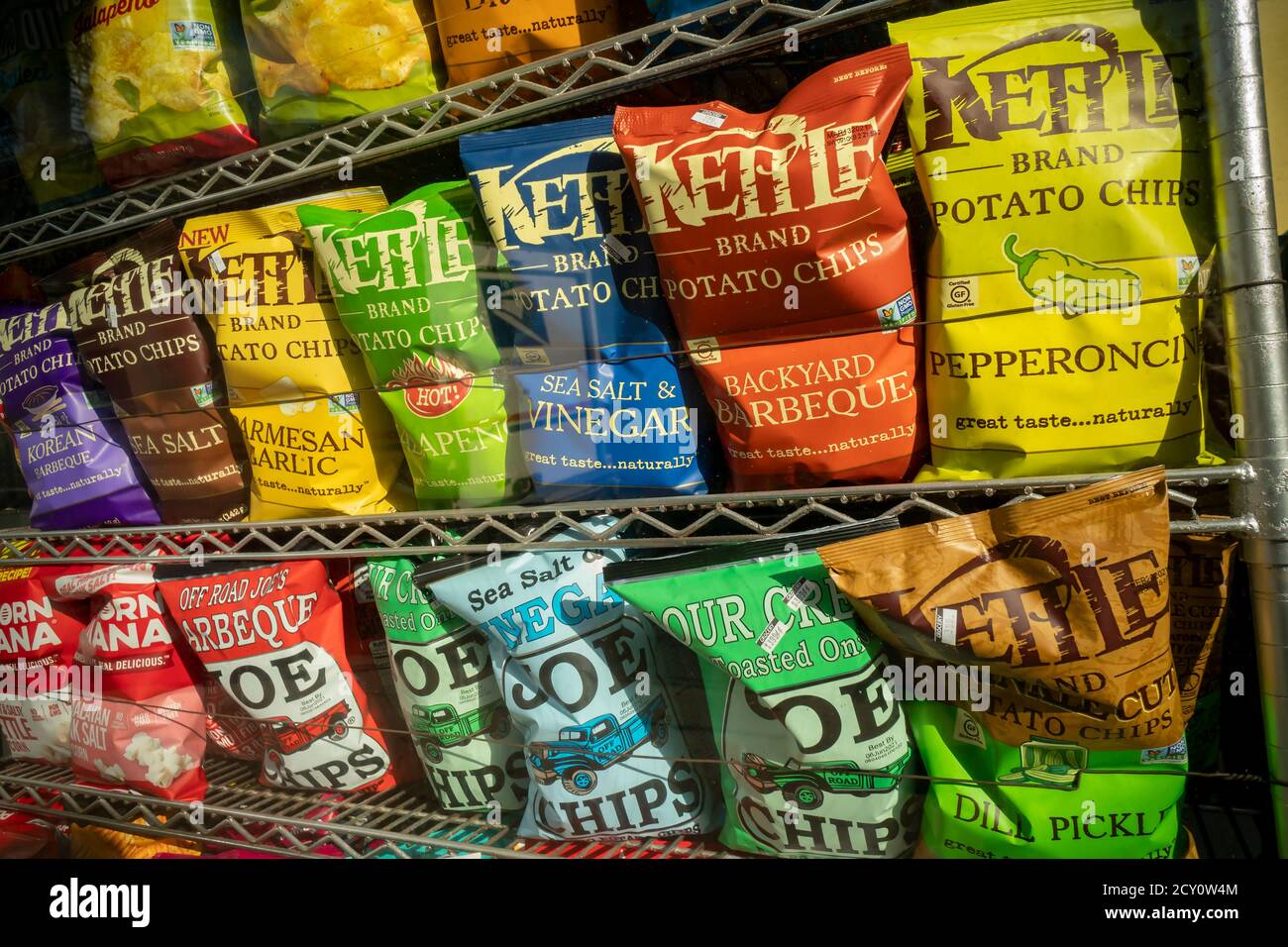 A window display of tasty Kettle and other brand potato  chips in New York on Wednesday, September 30, 2020. Kettle is a brand of the Campbell Soup Company. (© Richard B. Levine) Stock Photo