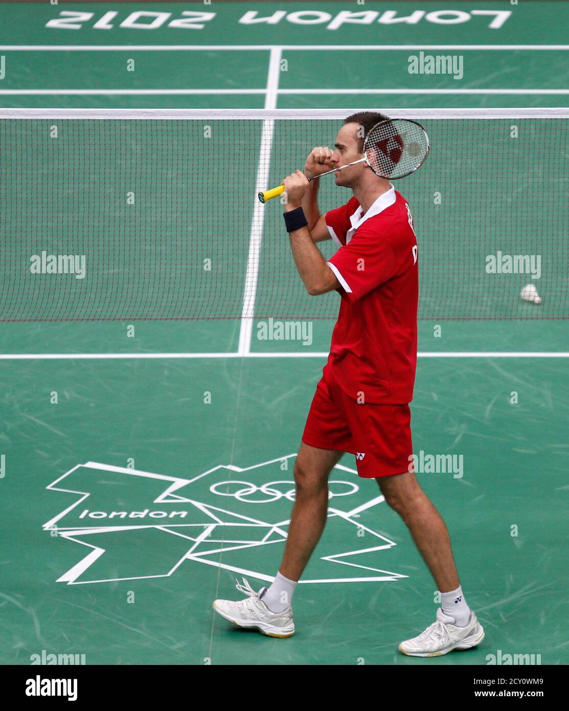 Denmark's Joachim Fischer celebrates winning against Indonesia's Tontowi  Ahmad and Liliyana Natsir during their mixed doubles badminton bronze medal  match during the London 2012 Olympic Games at the Wembley Arena August 3,